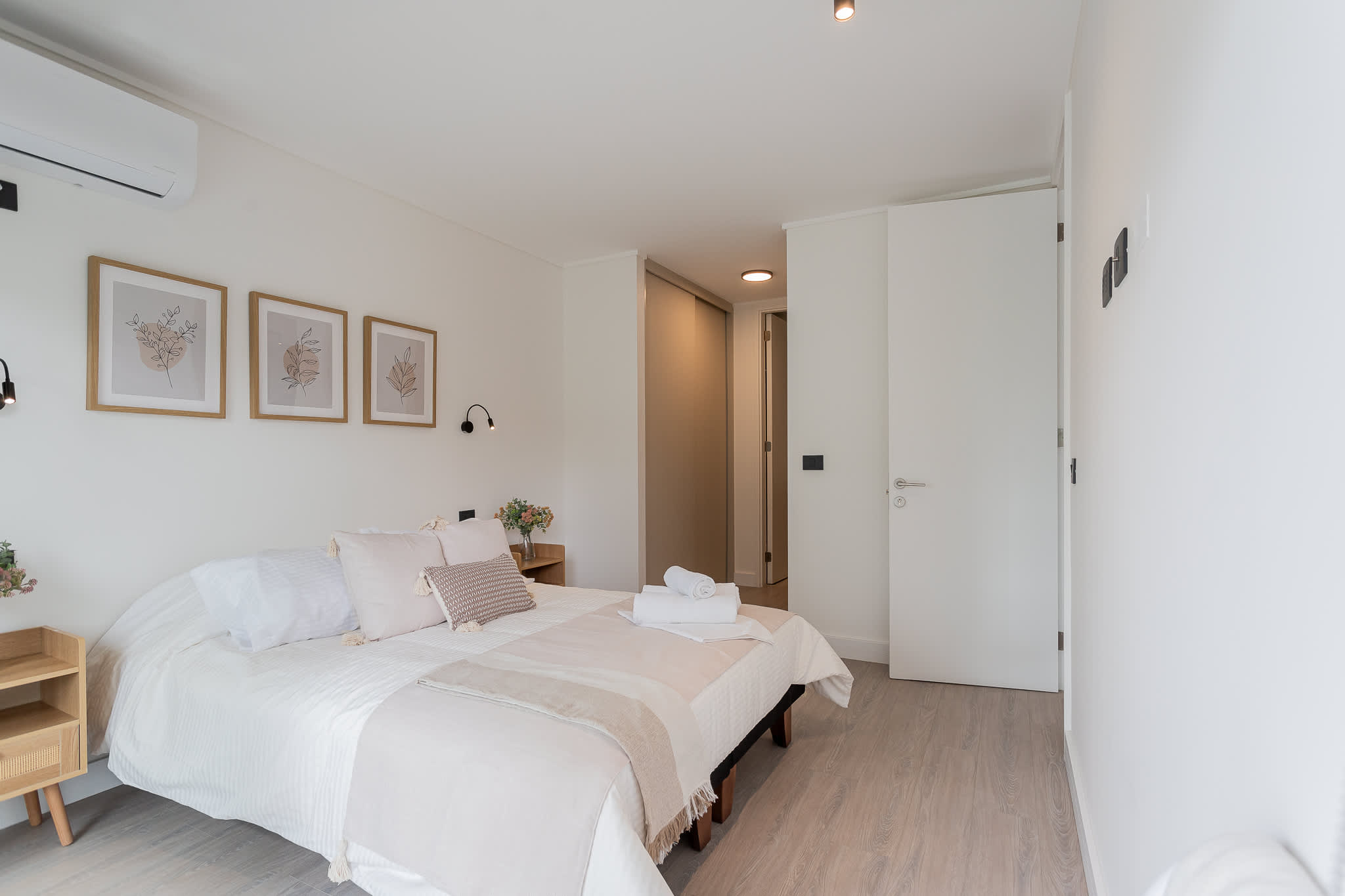 Relax in this serene bedroom featuring a cozy queen bed, stylish decor, and a calming atmosphere for your perfect getaway.