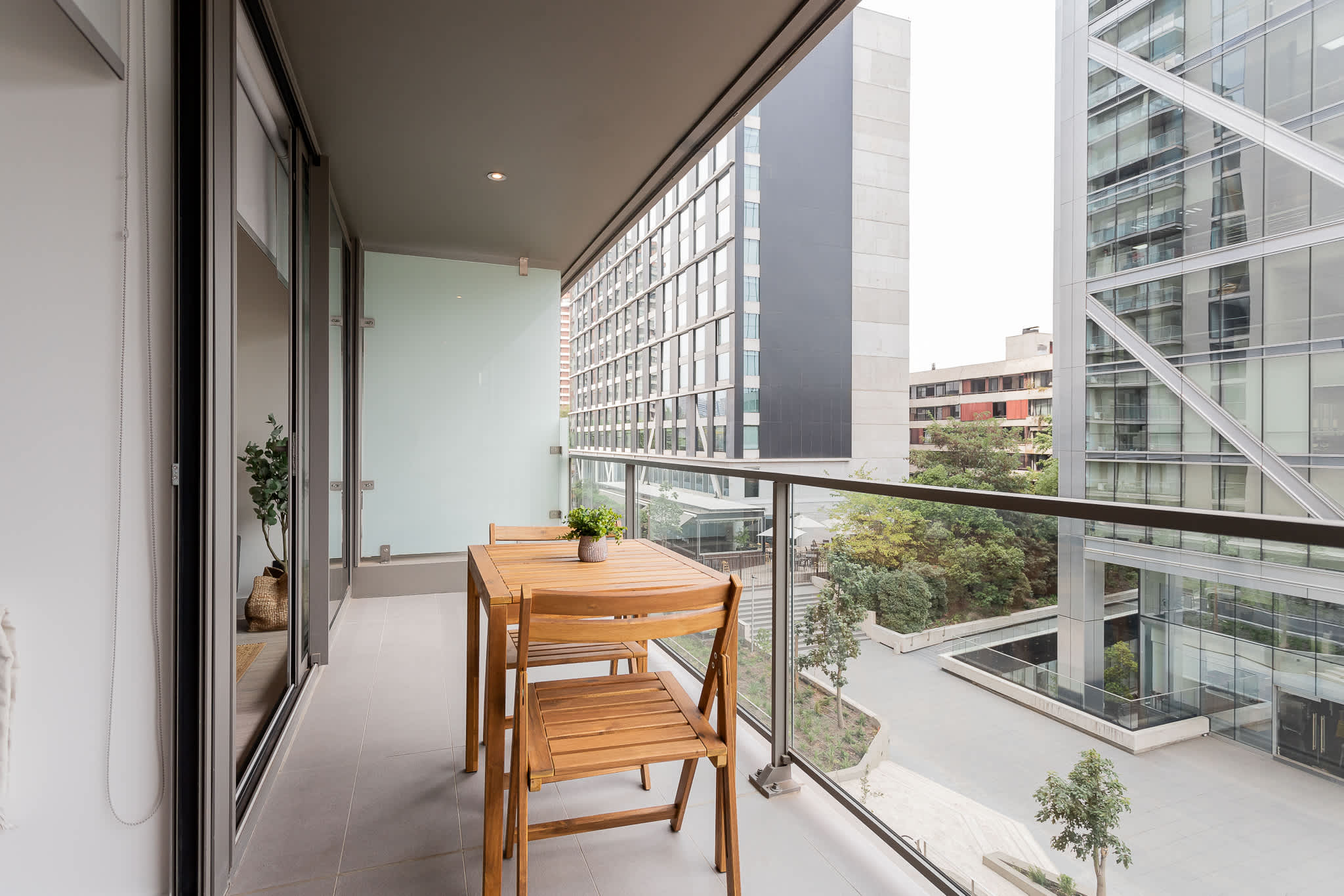 Enjoy a cozy balcony retreat with modern architecture views, perfect for a relaxing morning coffee or evening unwind.