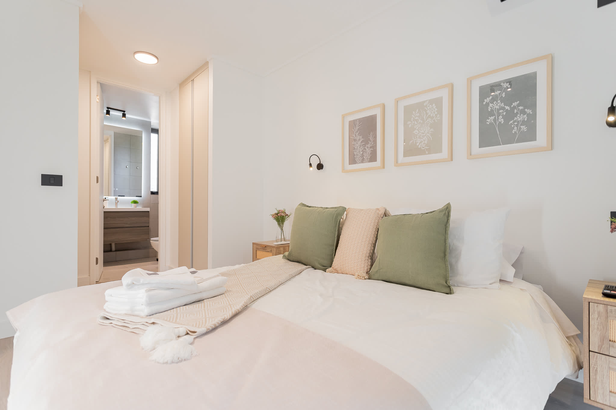 Relax in this cozy bedroom with a plush bed and en-suite bathroom, perfect for unwinding after exploring the city.