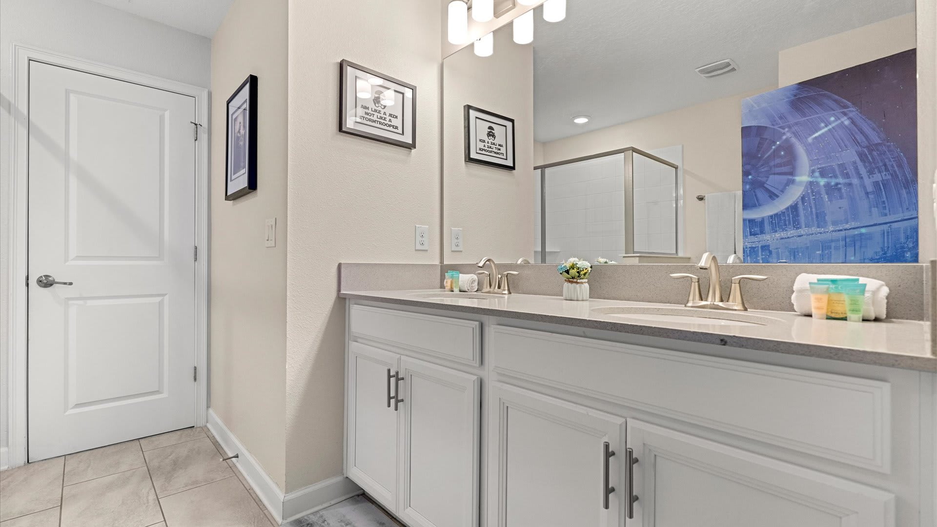 Spacious bathroom with double vanity and standing shower