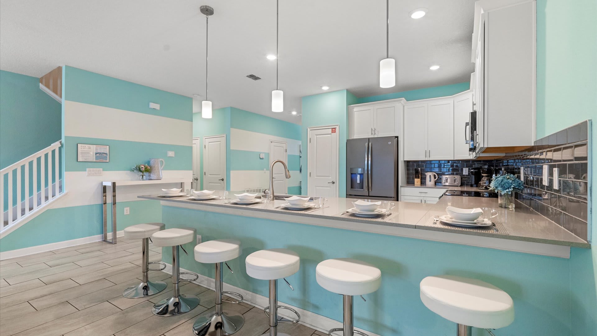 Kitchen area with breakfast bar seating 