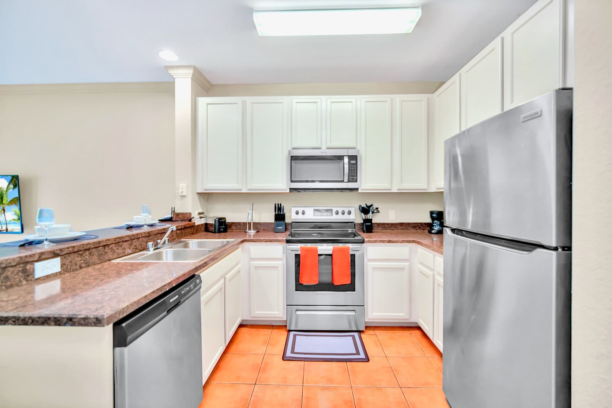 Fully equipped kitchen with silver appliances