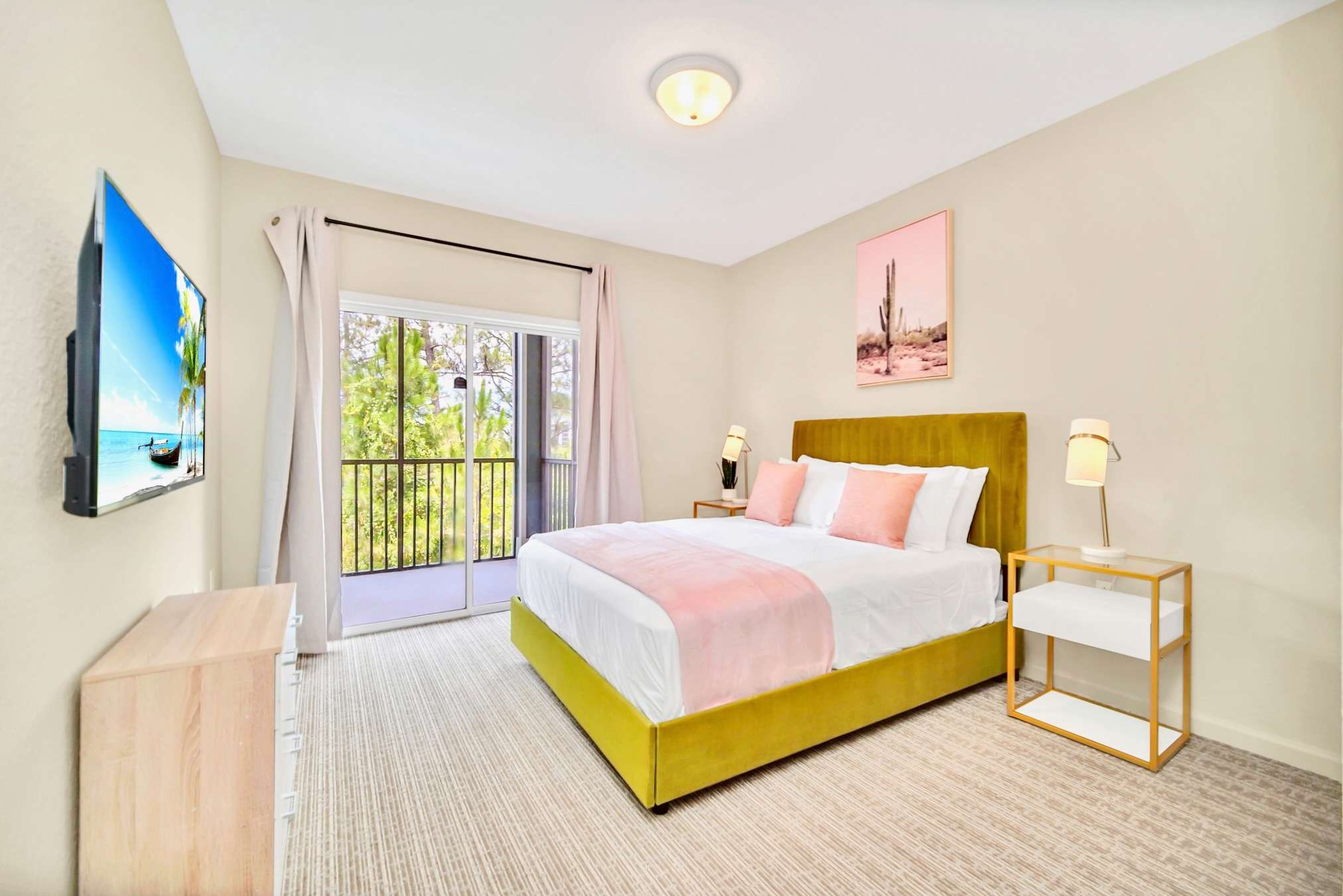 Vibrant Queen bedroom with smart TV and patio access