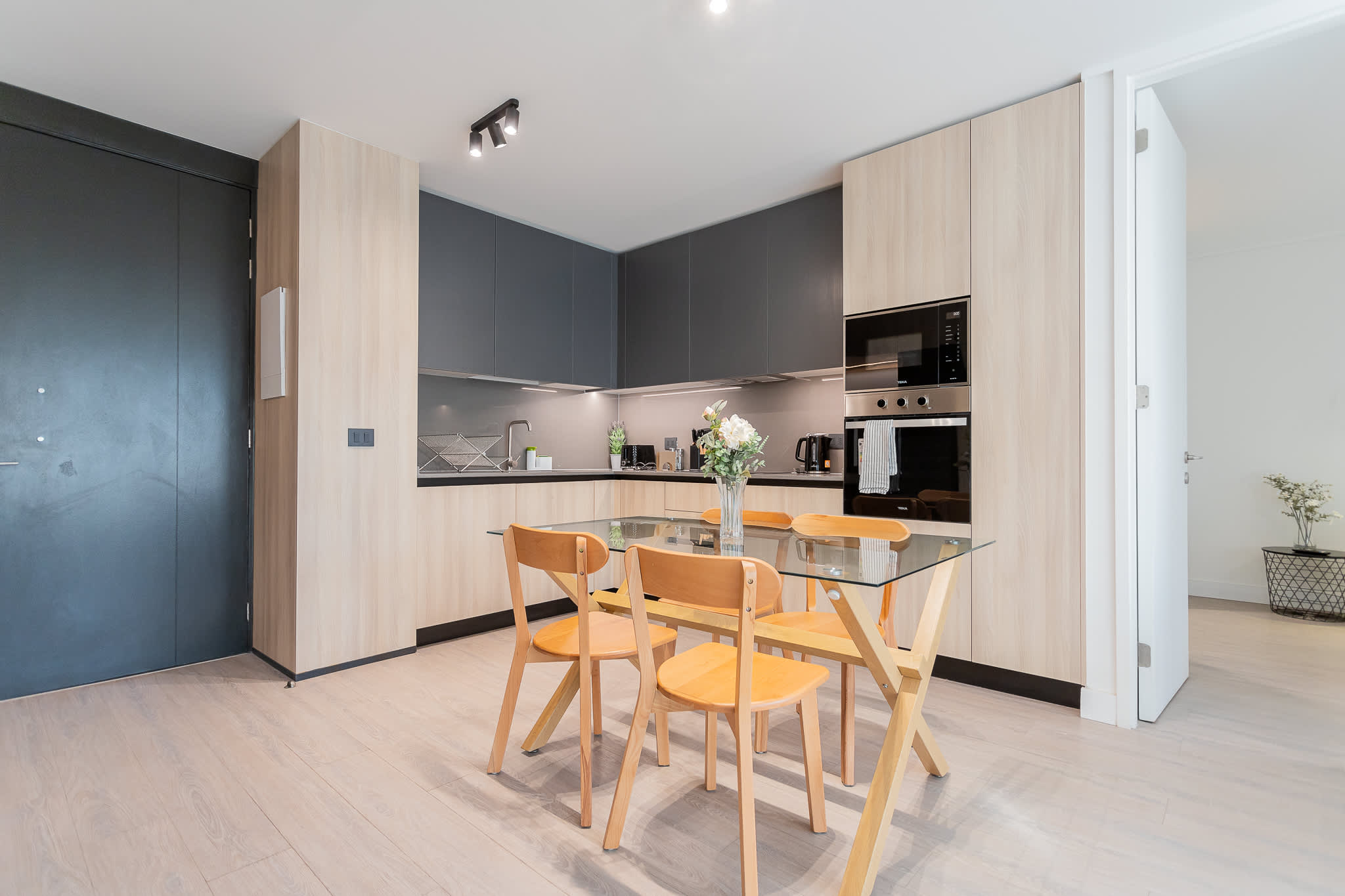 Enjoy a stylish and modern kitchen perfect for family meals and gatherings, equipped with sleek appliances and a cozy dining area.