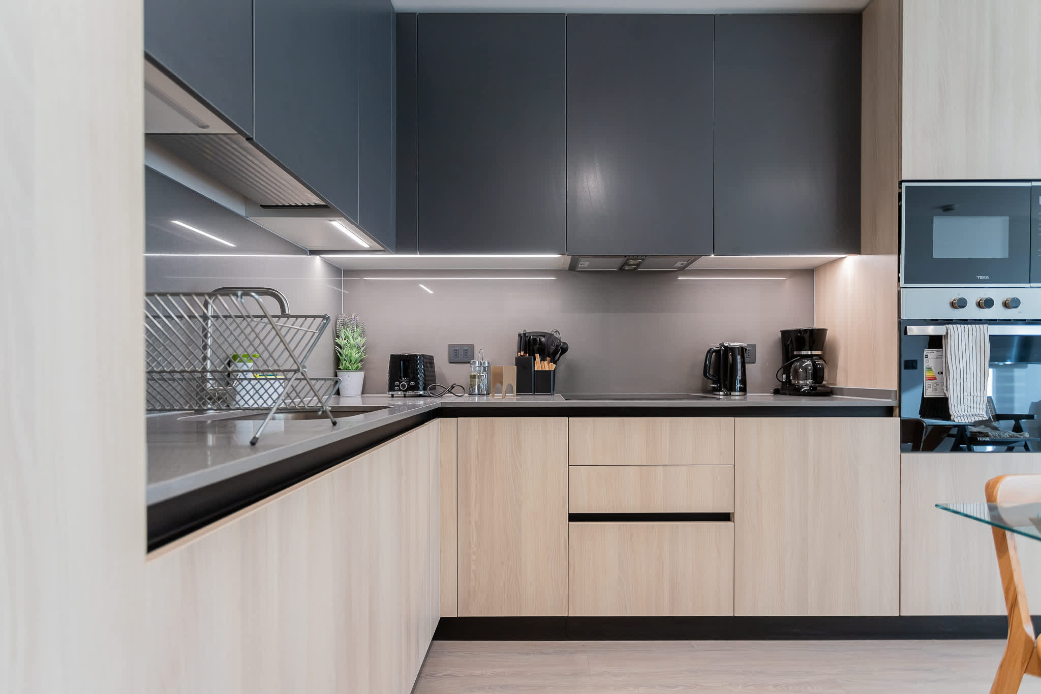 Experience a sleek, modern kitchen equipped with top-notch appliances and stylish finishes, perfect for your culinary adventures!