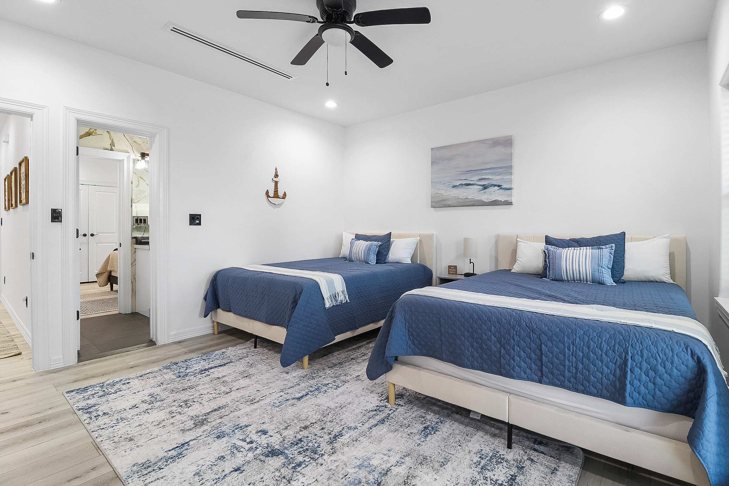 Double queen bedroom with shared bathroom