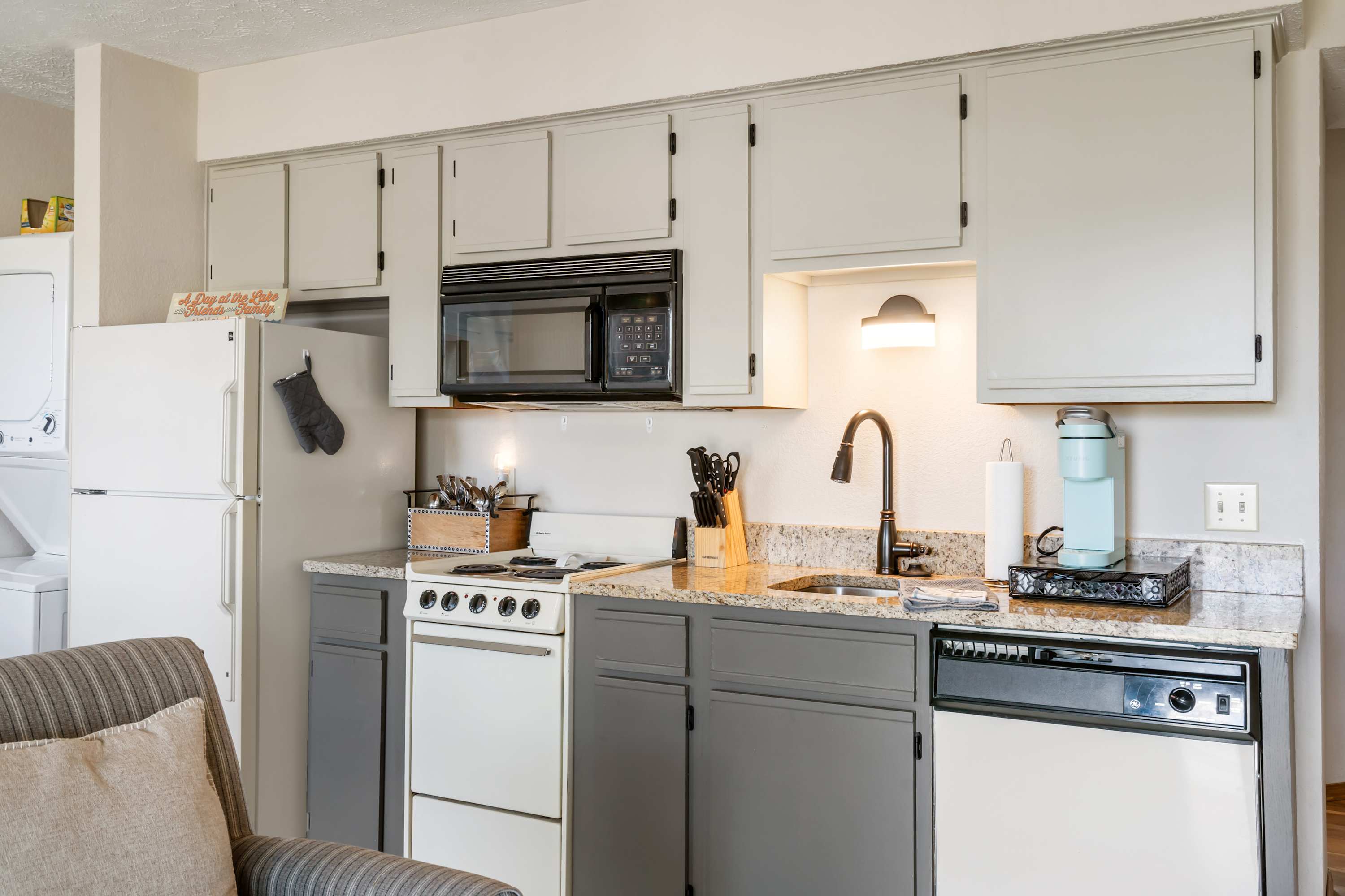 The open kitchen offers ample storage & every home comfort
