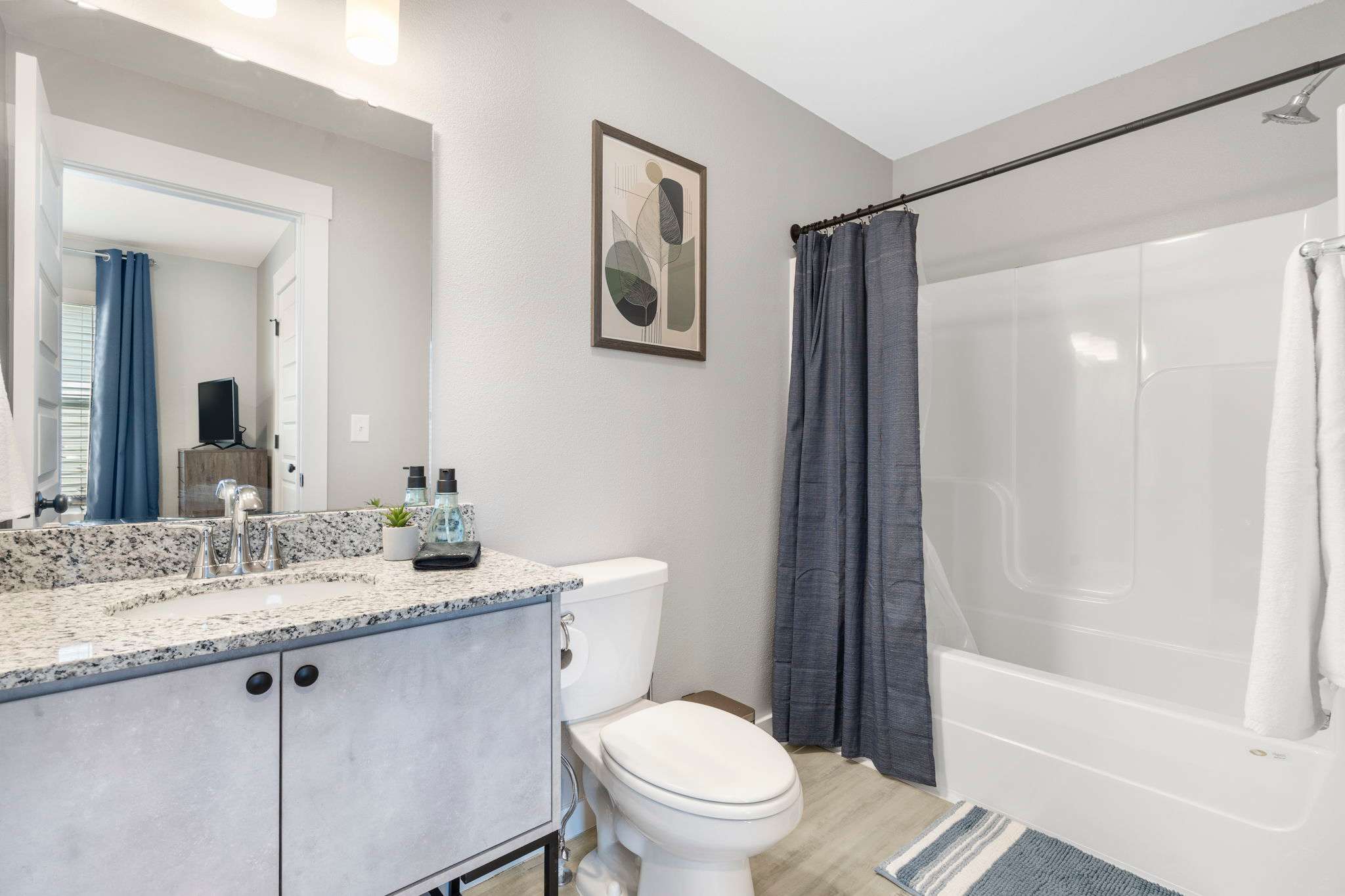 Shower/tub combination with shampoo, bodywash, and conditioner provided.
