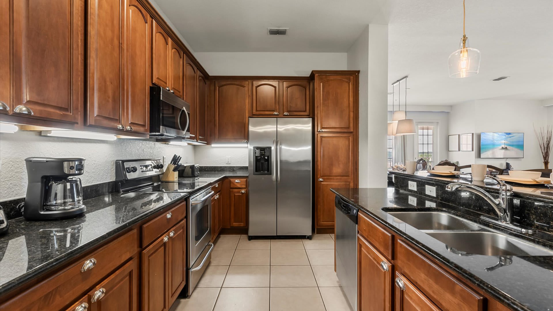 Fully-equipped family kitchen featuring silver appliances
