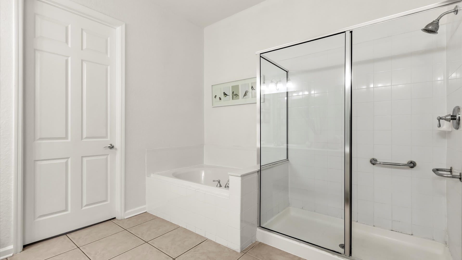 Ensuite Bathroom featuring walk-in shower and bathtub