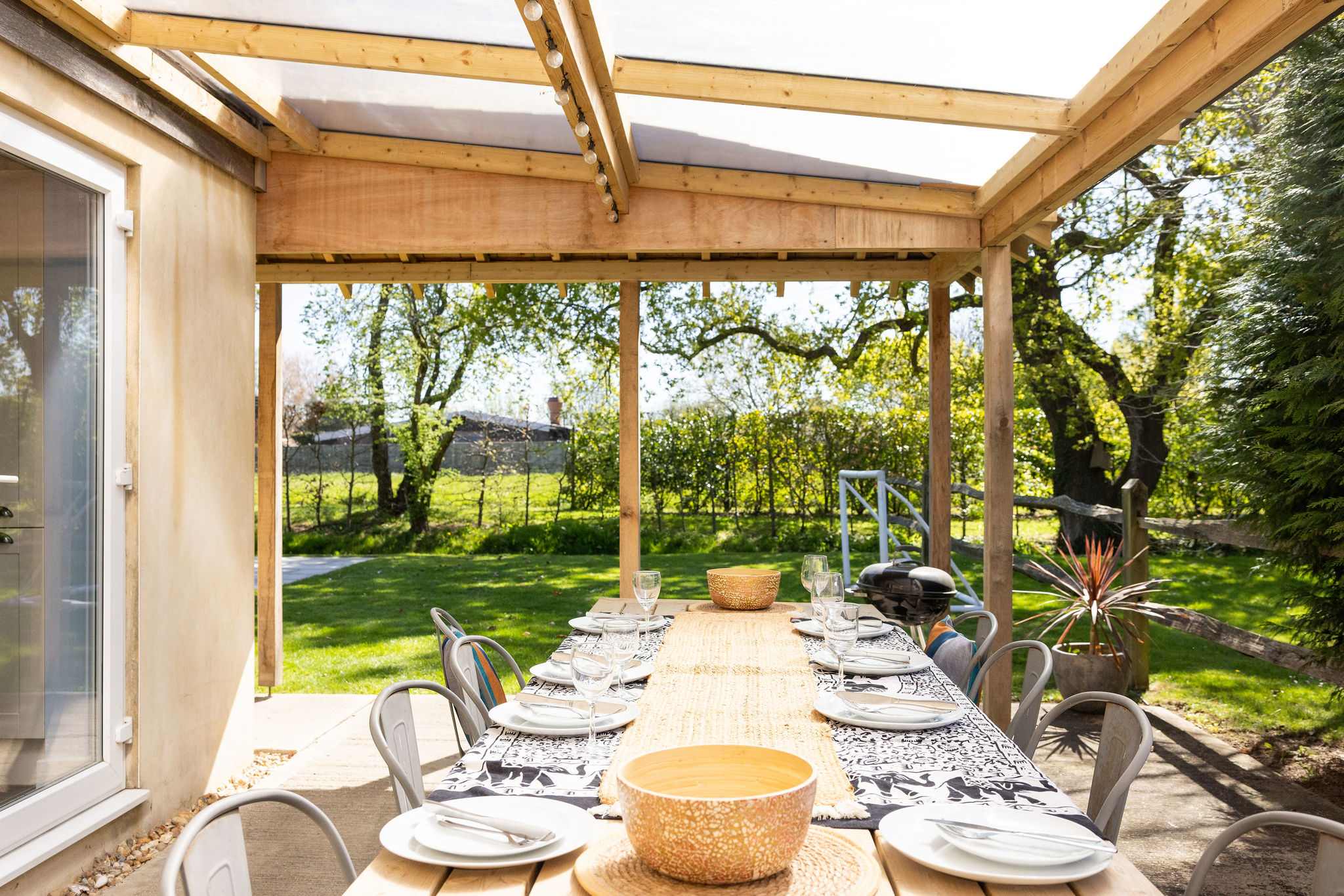 The home has a sunny, private patio, perfect for alfresco dining and leisurely evenings as the sun sets.