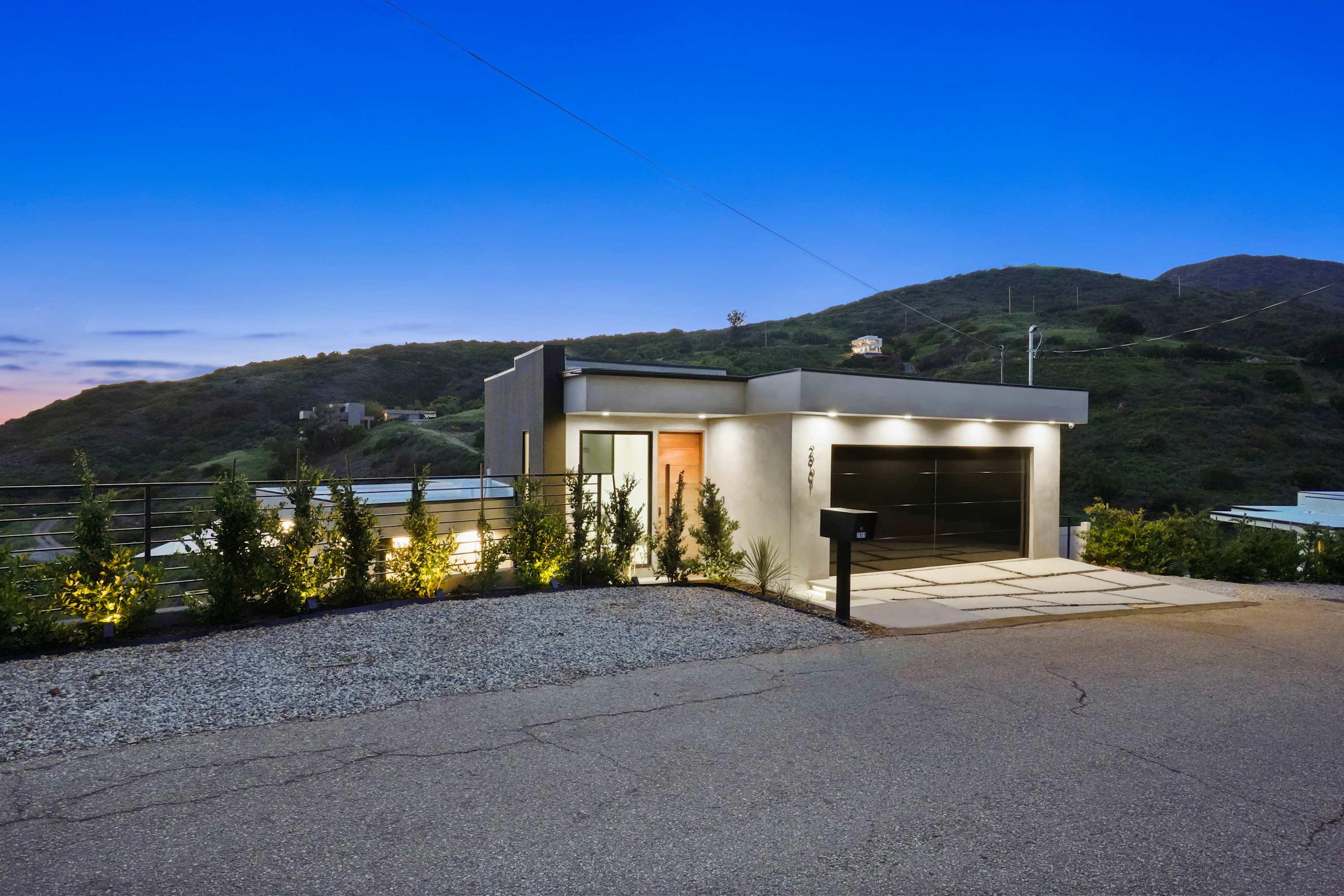 Spacious drive with direct entry into the garage and front door.