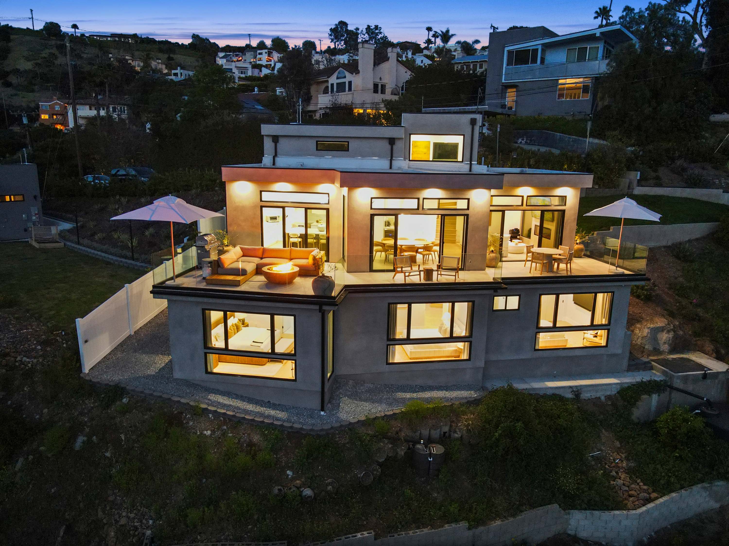 Multi-level design featuring glass-lined terraces and modern finishes.