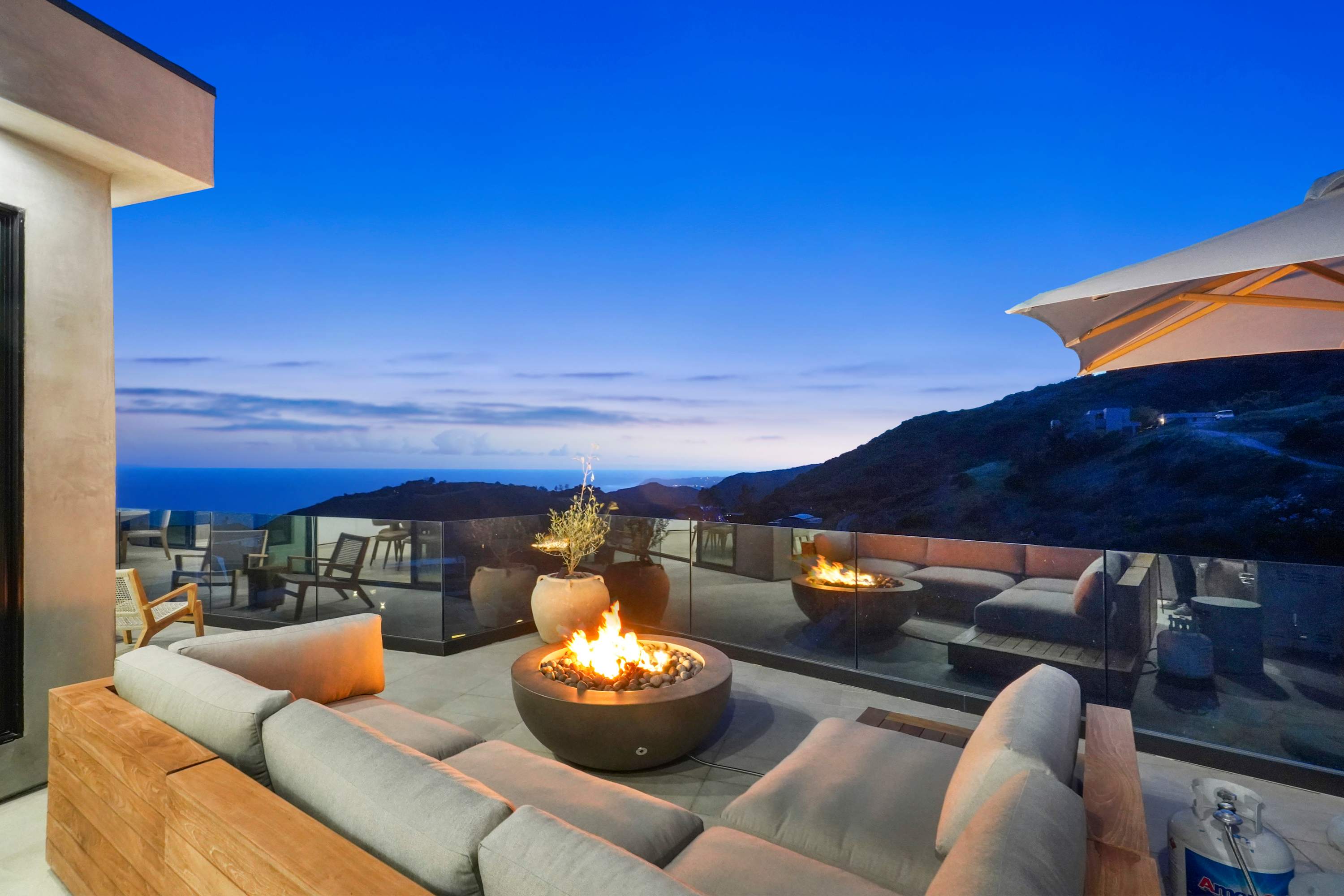 Relax fireside with sweeping views of Malibu’s rugged landscape.