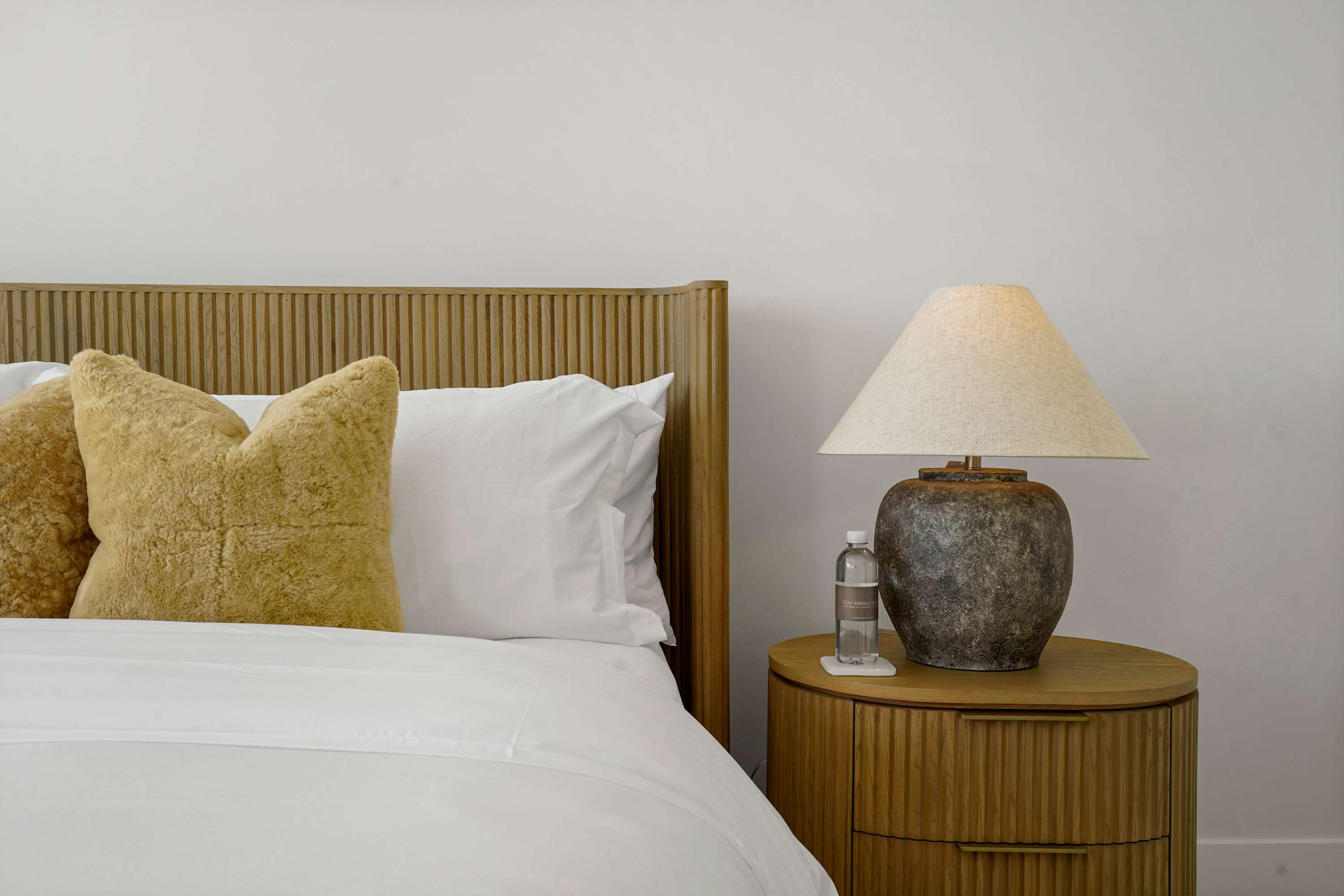 Crisp white linens layered with soft neutral accents.