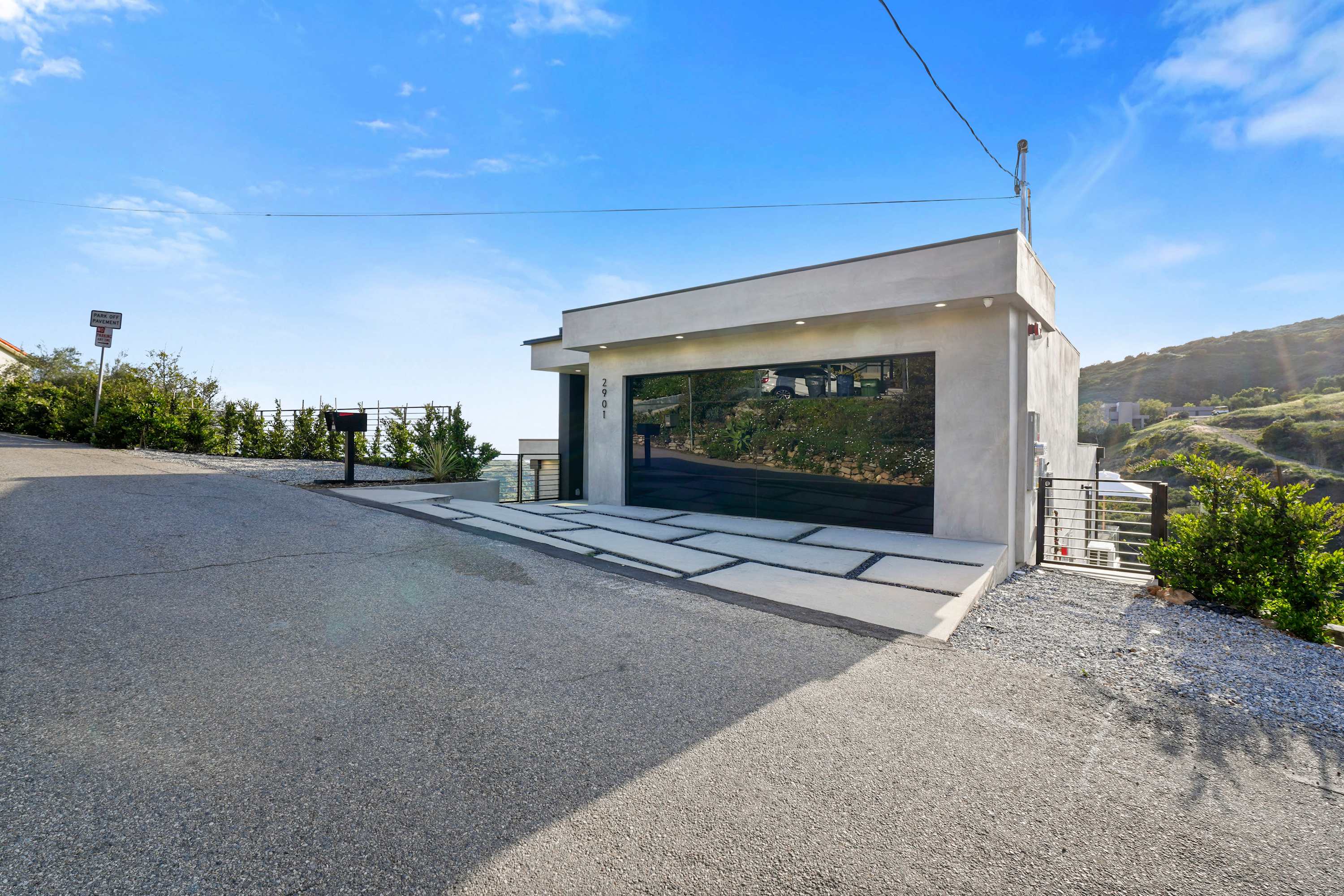 Spacious driveway with additional parking in front of the garage.