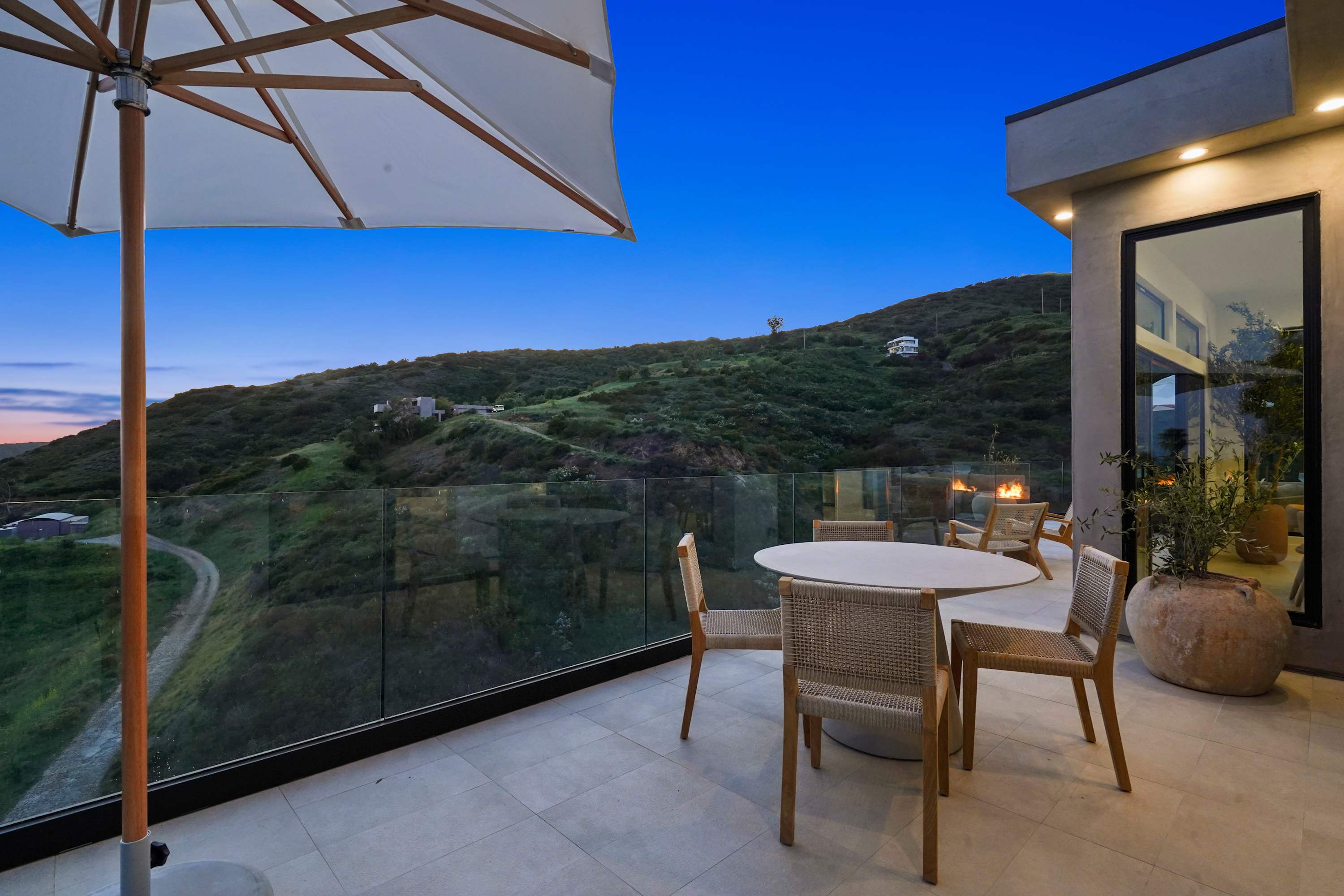 Open-air dining under soft evening skies.