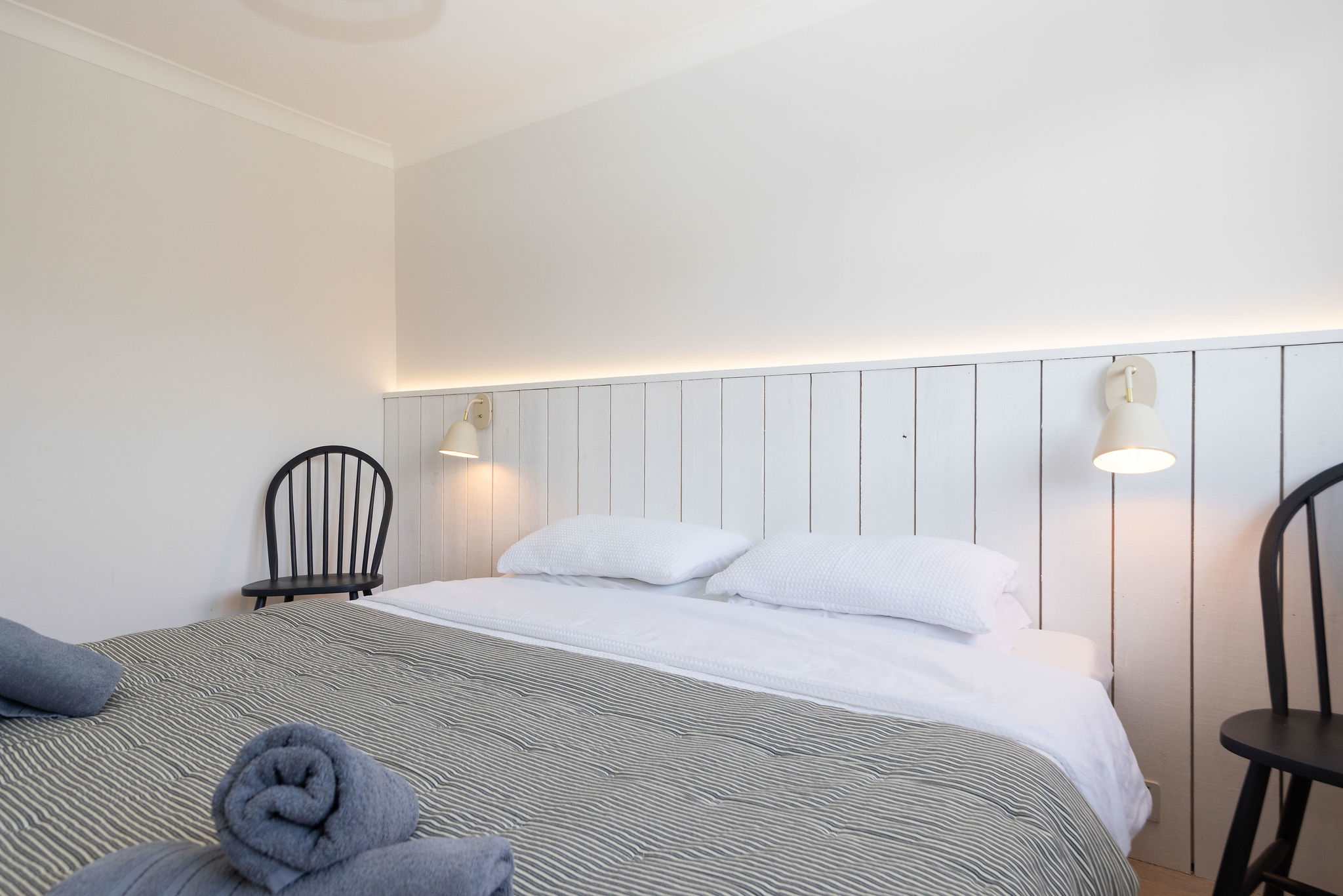 The second king room, with reading lamps and side chairs.