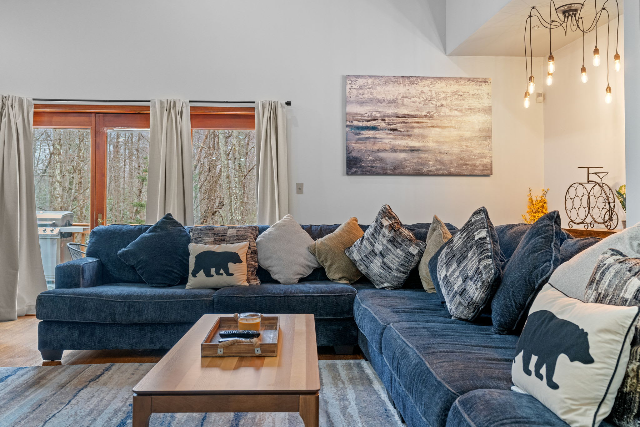 Soft Light and Comfort
Large windows let in the sunshine while the plush sectional invites you to sink in and relax.