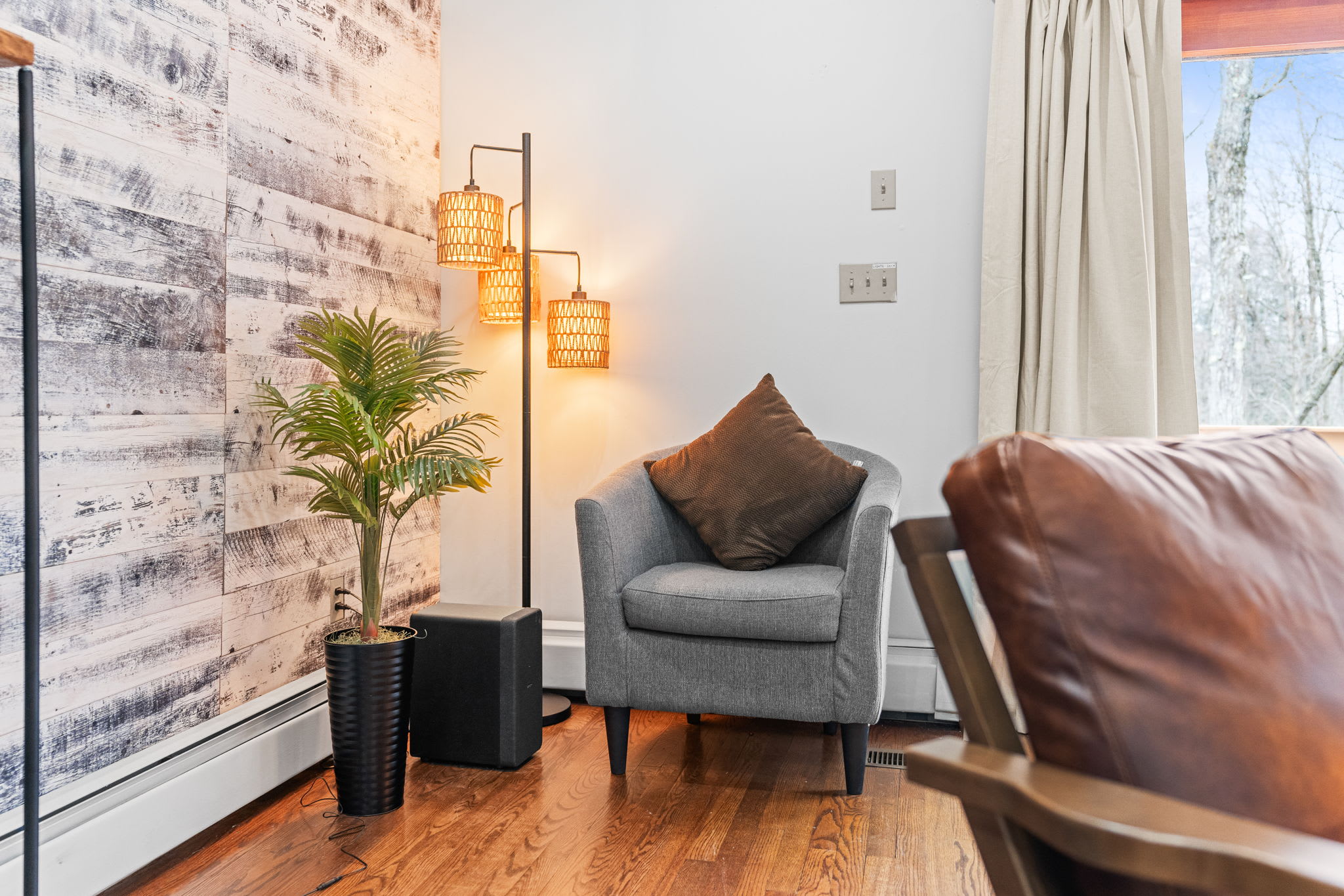 Peaceful Corner Nook
A comfy chair, warm lighting, and a touch of greenery make this the perfect reading or coffee spot.