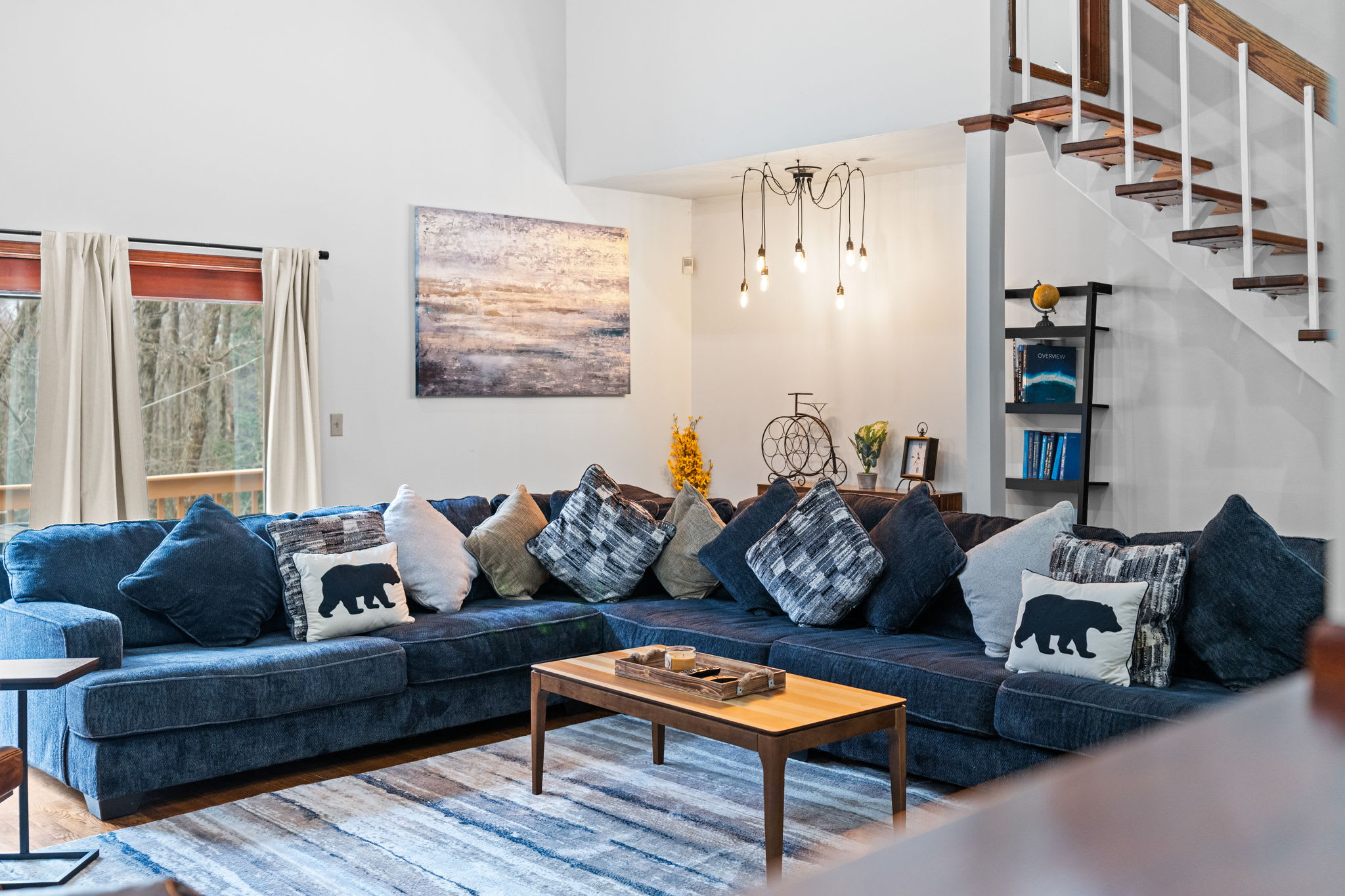 Charming Comfort Zone
This cozy sectional sits beneath soft lighting and rustic decor, setting the mood for relaxed hangouts.