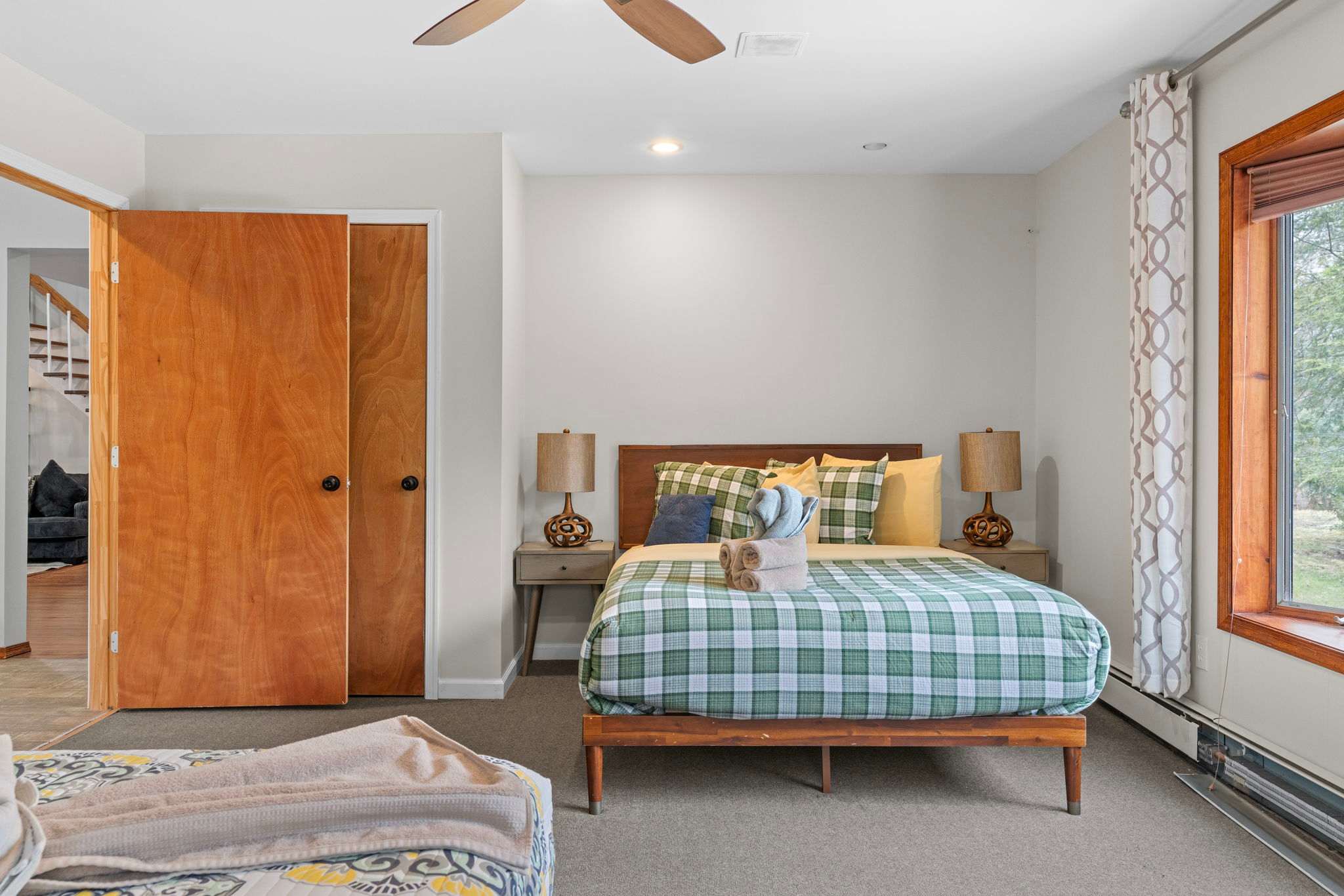 Warm Wood Touches
This bedroom blends comfort and calm with natural light, earthy tones, and a welcoming bed.