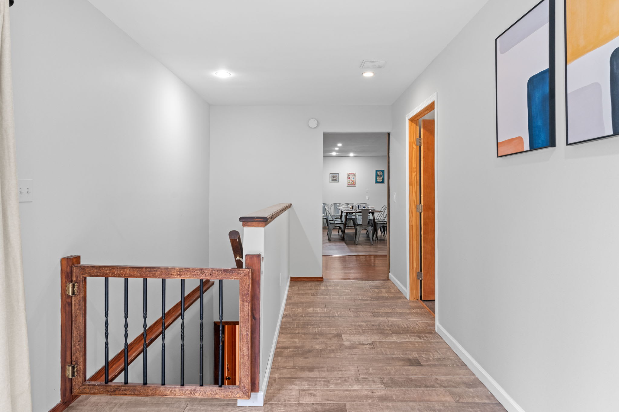 Clean and Bright Passageway
Fresh white walls and warm wood tones guide you through this open and airy upstairs corridor.