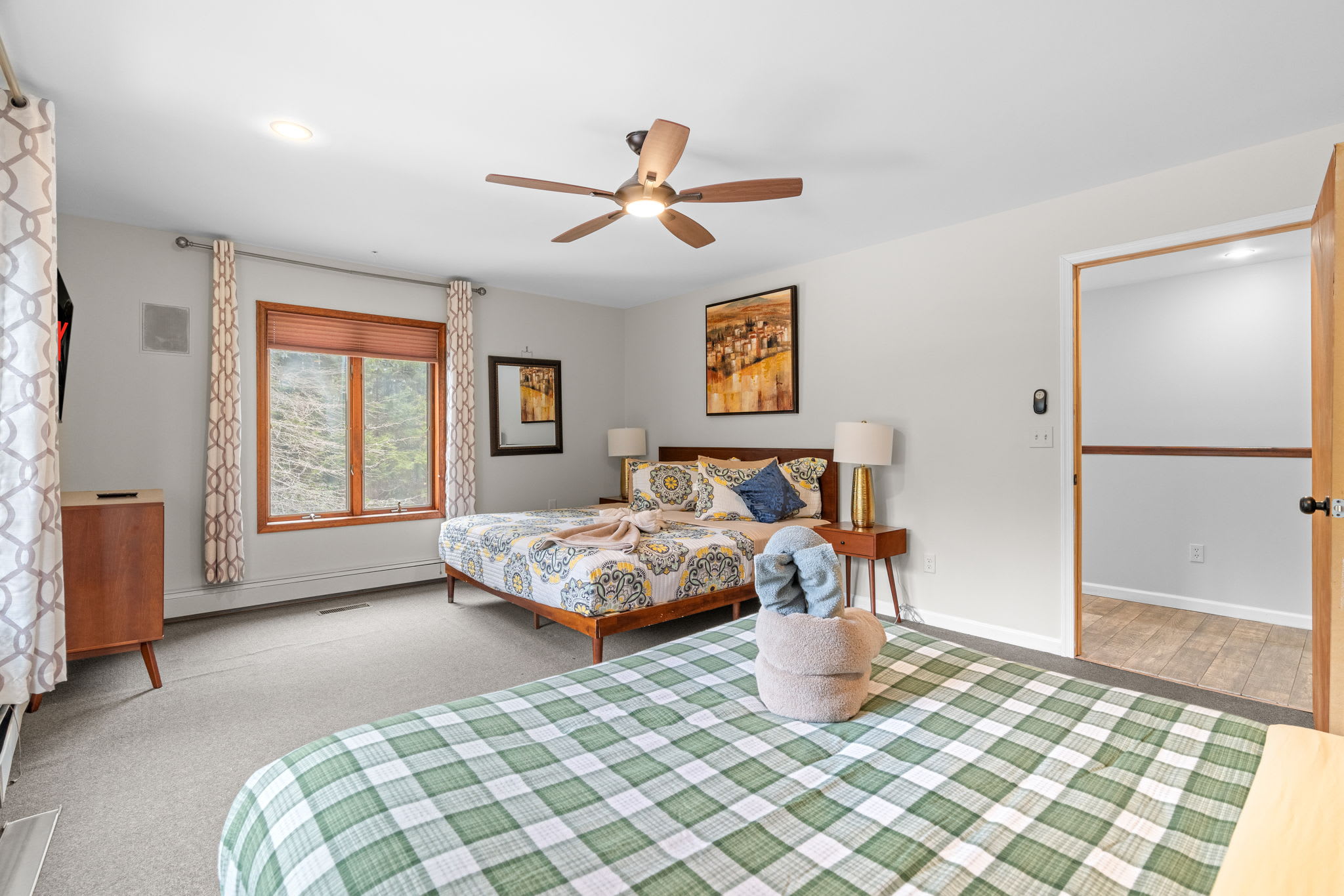 Double the Comfort
Two cozy beds, ceiling fans, and soft natural light make this room perfect for families or friends traveling together.