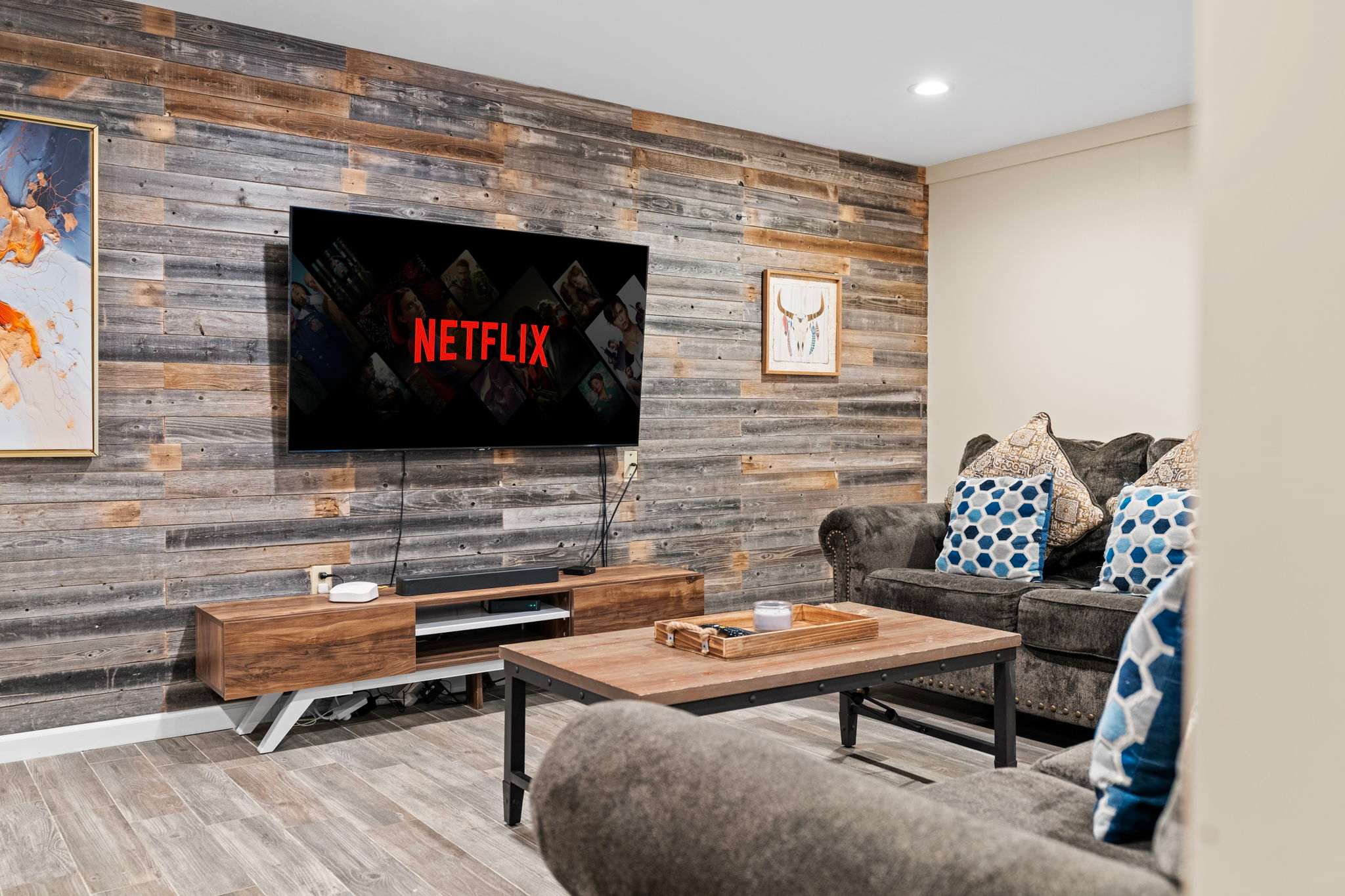 Rustic Meets Relaxation
Soft textures and wood accents give this media space the perfect mix of charm and comfort.