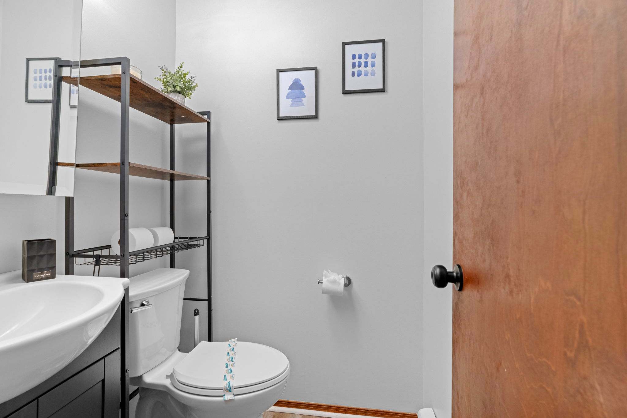 Modern Bathroom Touches
Simple, clean, and thoughtfully organized with open shelving and cozy decor accents.