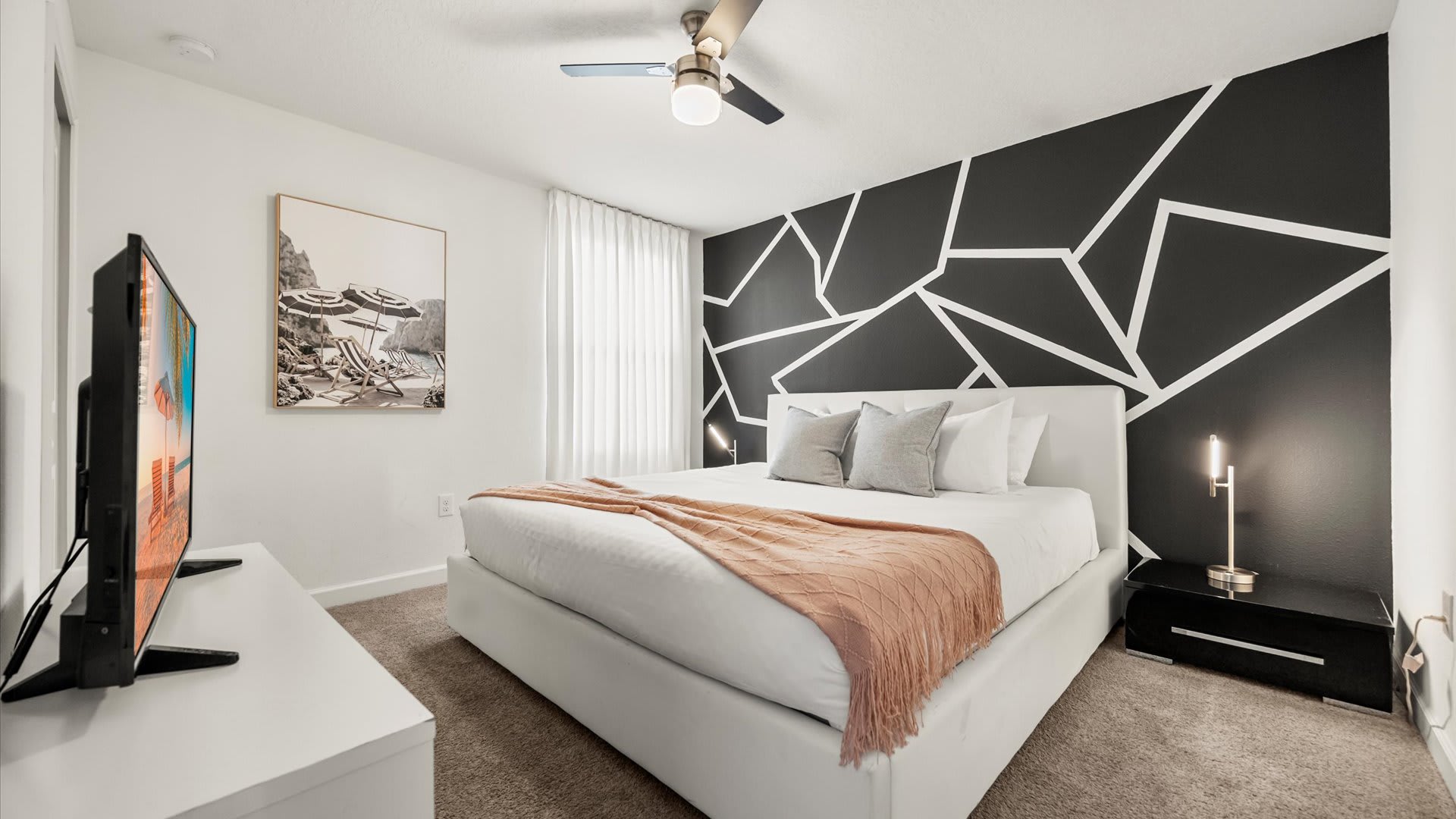 Contemporary King bedroom with smart TV