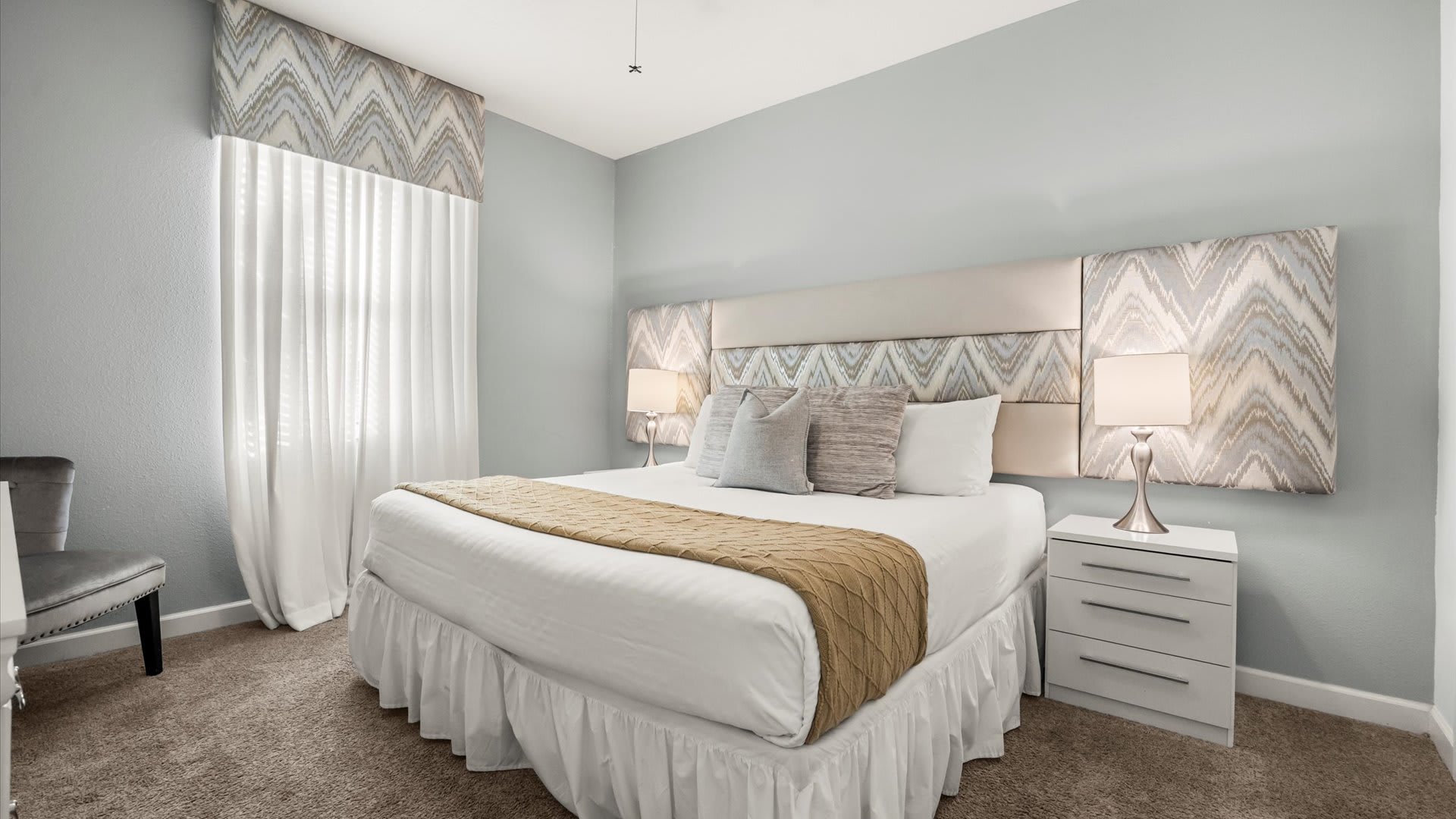 King Bedroom with fresh linens and fluffy pillows