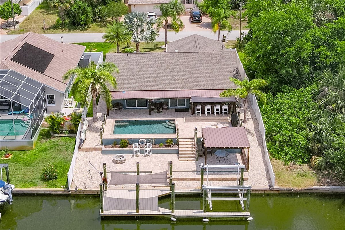 Waterfront Retreat with Pool, Tiki Bar & Boat Dock