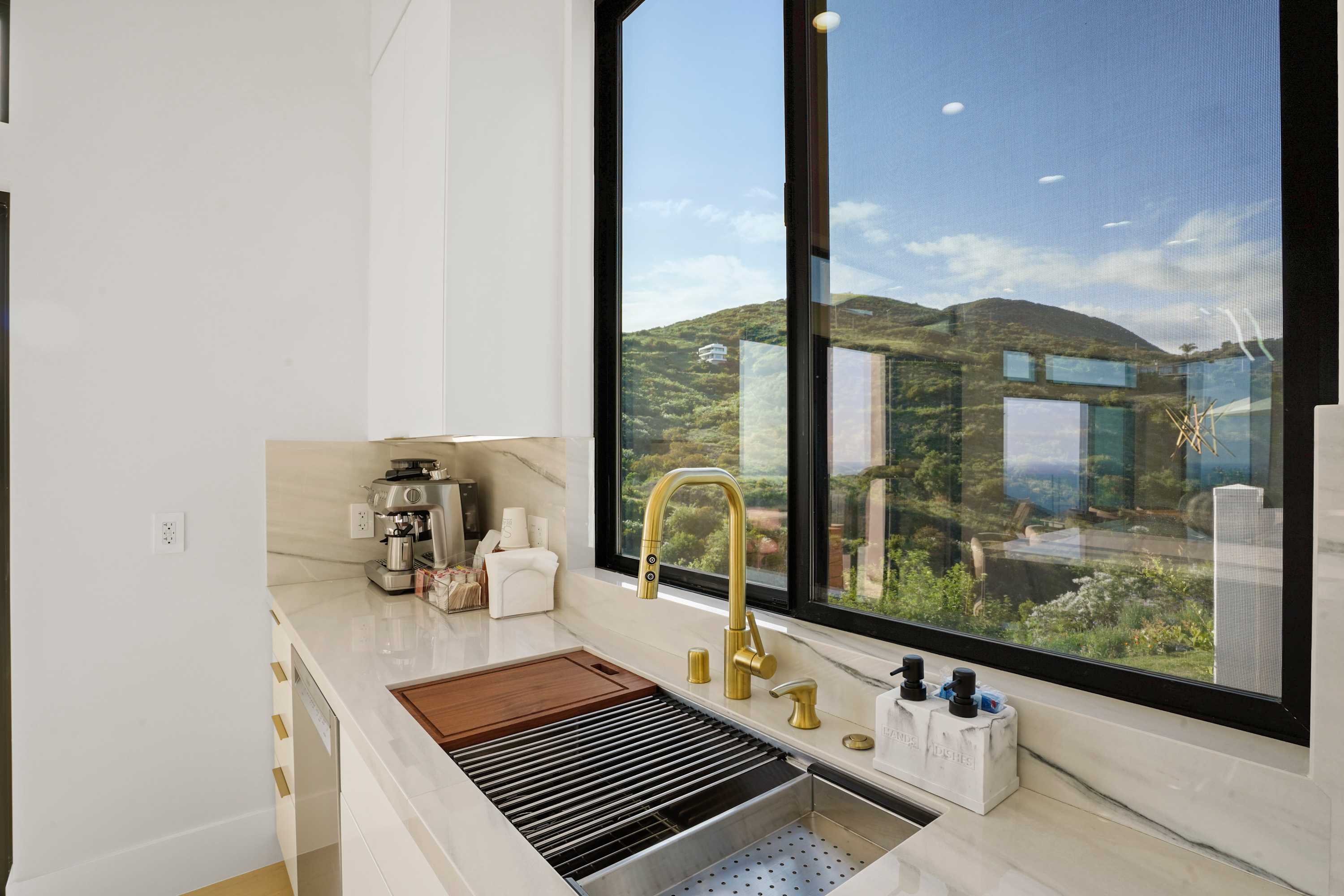 Stainless steel Viking dishwasher integrated next to the sink.