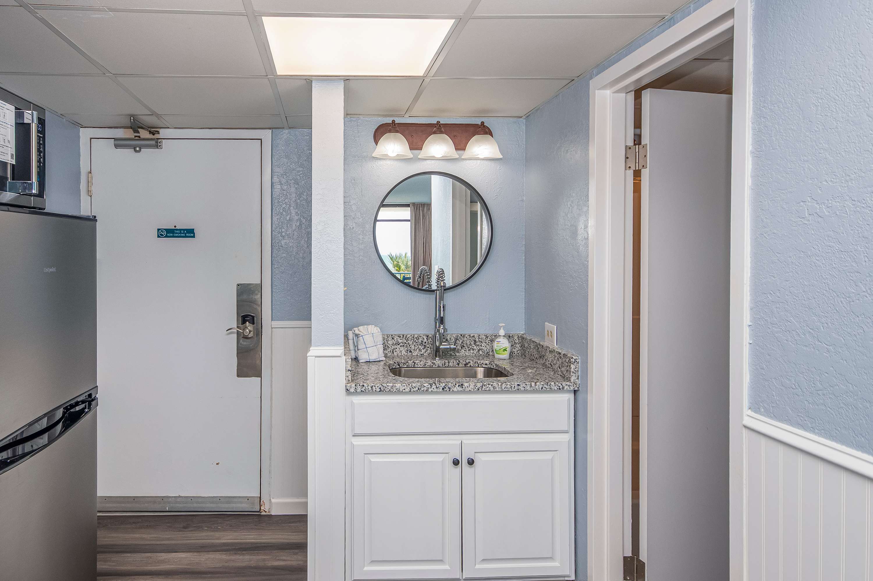 Wet bar with new granite top for your convenience 