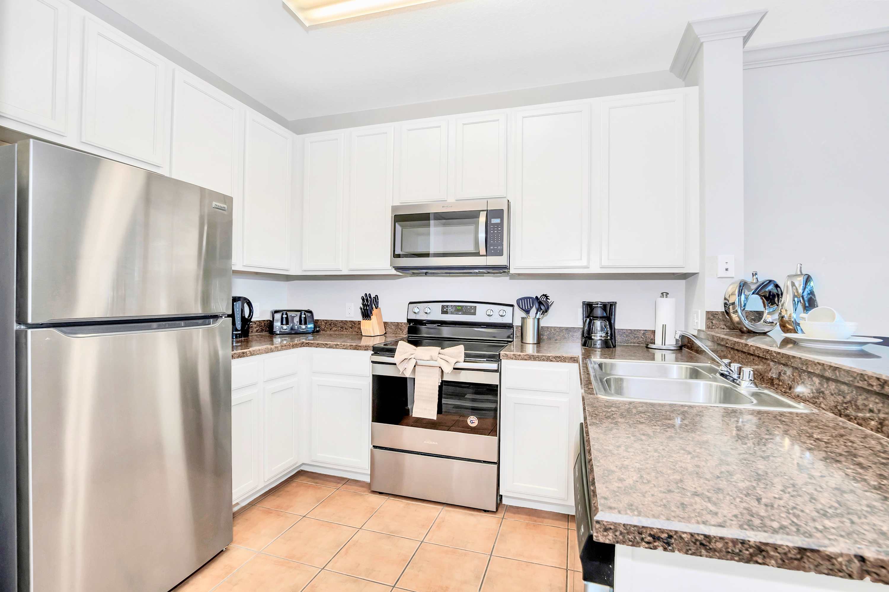 Fully equipped kitchen with silver appliances
