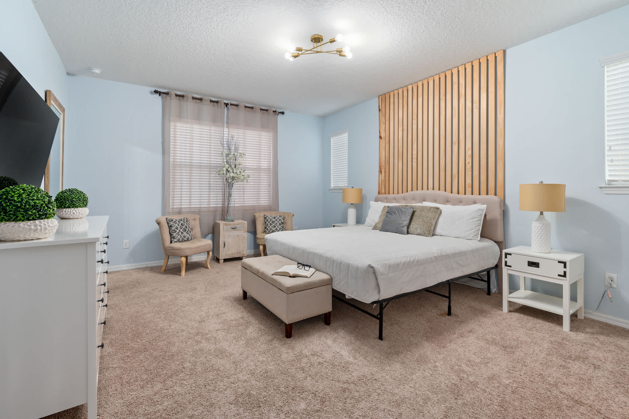 Unwind in our serene and stylish bedroom at our home. Perfect for a restful night's sleep after a day of fun