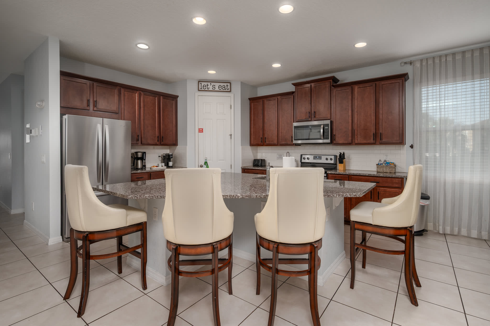 Enjoy the convenience of a fully equipped kitchen with a large island and modern appliances in our Solara Resort home.
