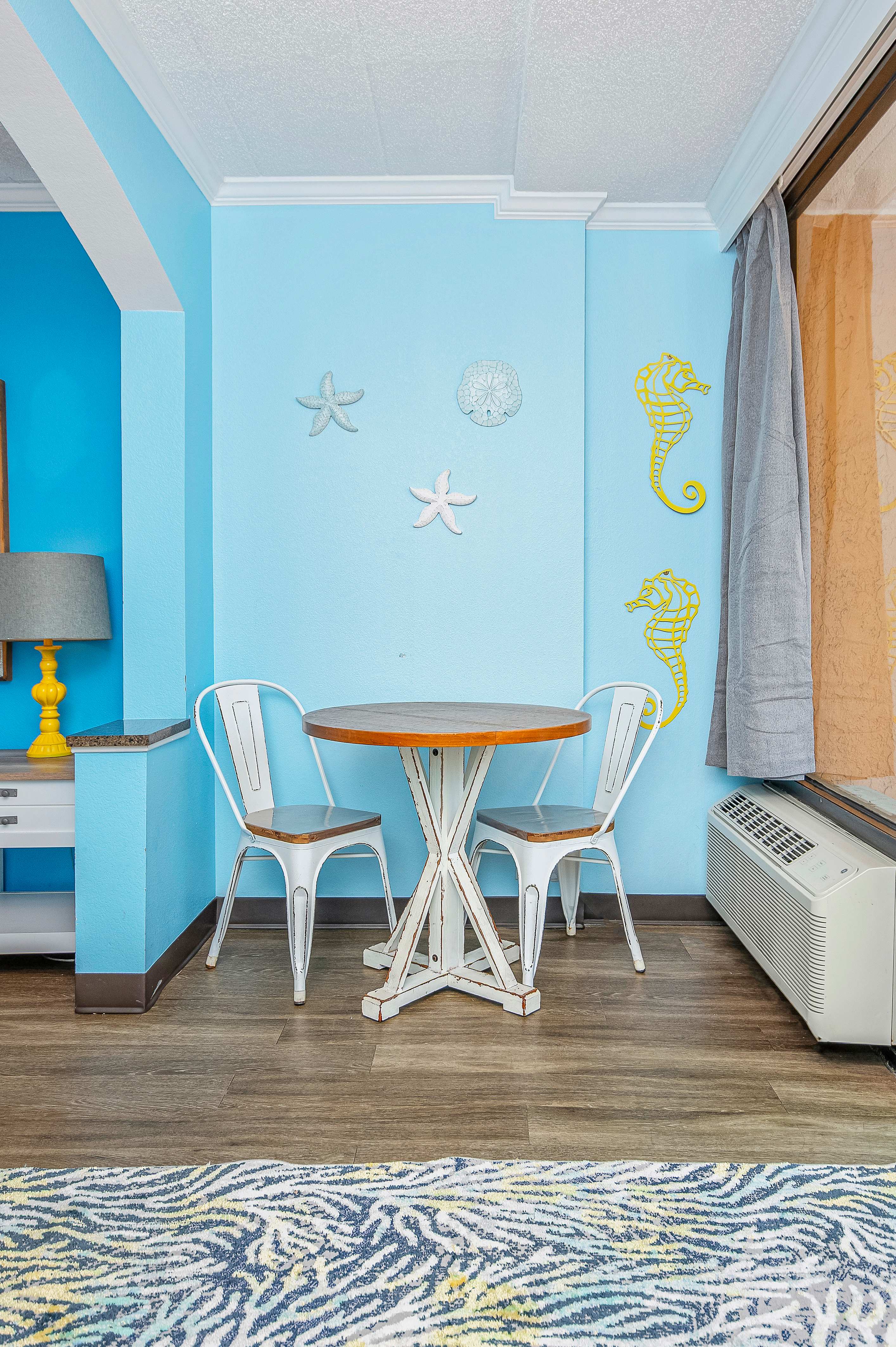 A dining space that combines comfort with coastal charm.