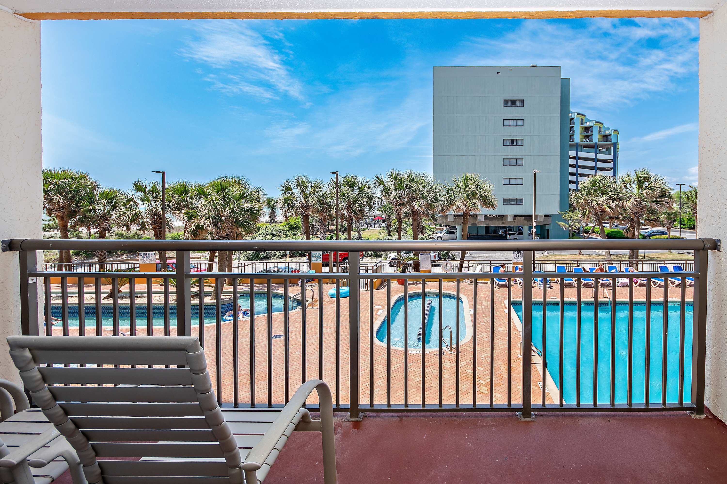 A balcony view that keeps you connected to the poolside action.