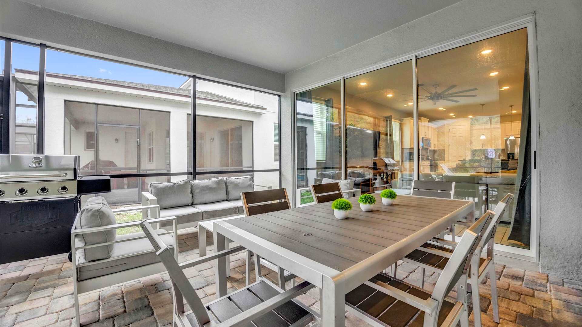 Outdoor patio with dining area and BBQ girll