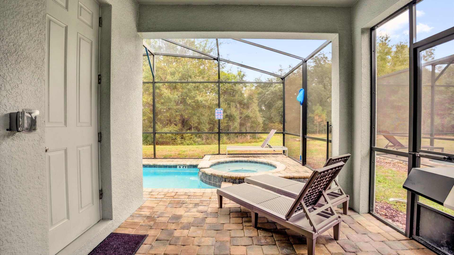 Outdoor swimming pool with sun loungers