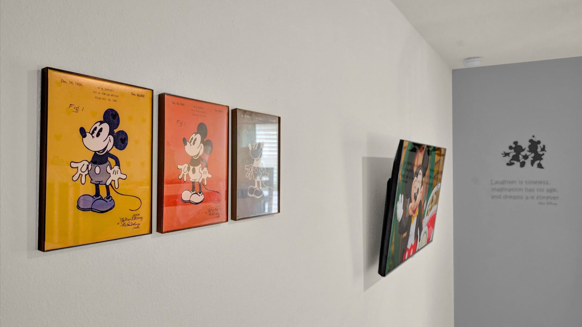 Mickey-Moused Artwork and Smart TV in Bedroom 
