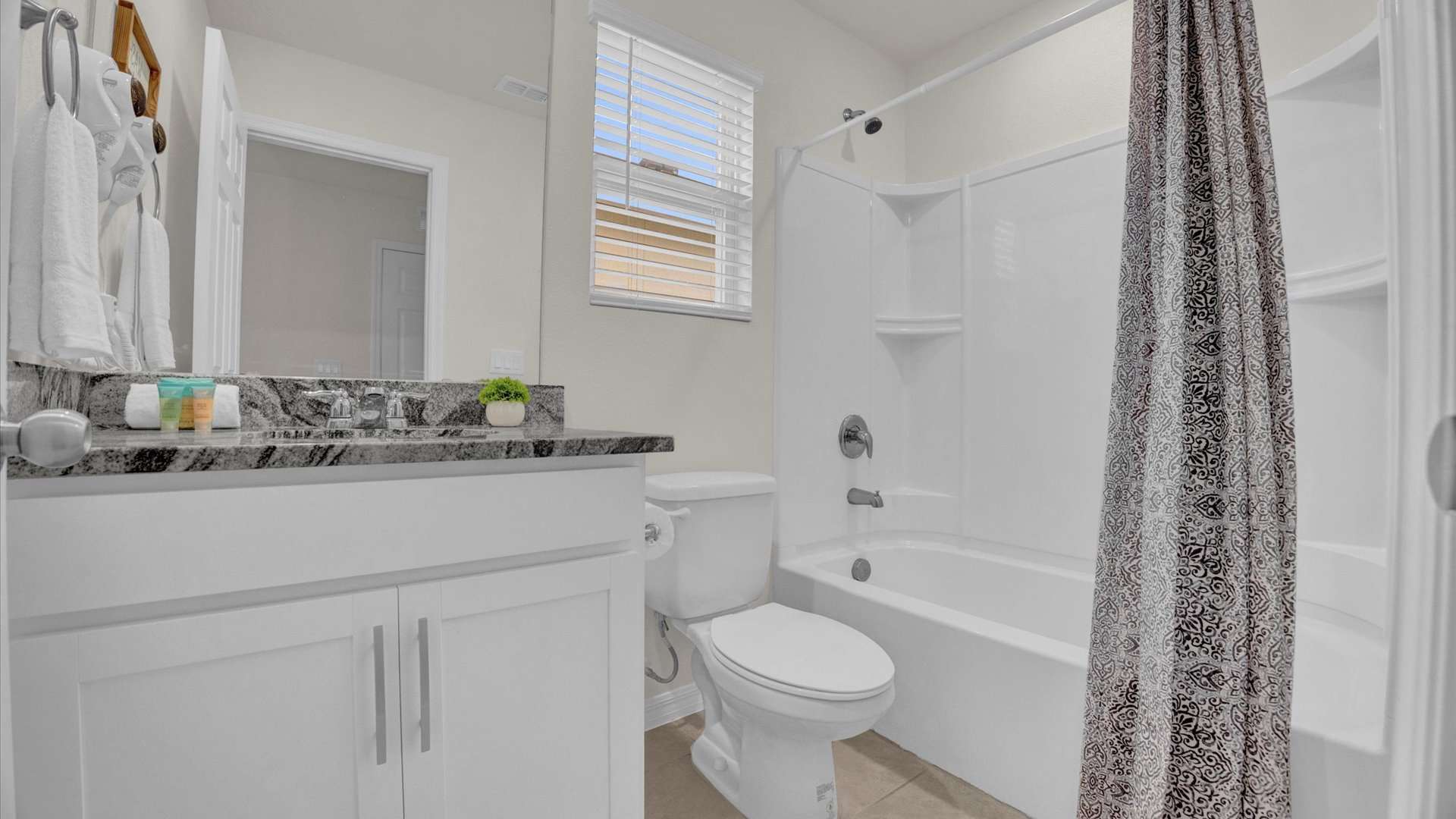 Full bathroom with integrated shower and bathtub