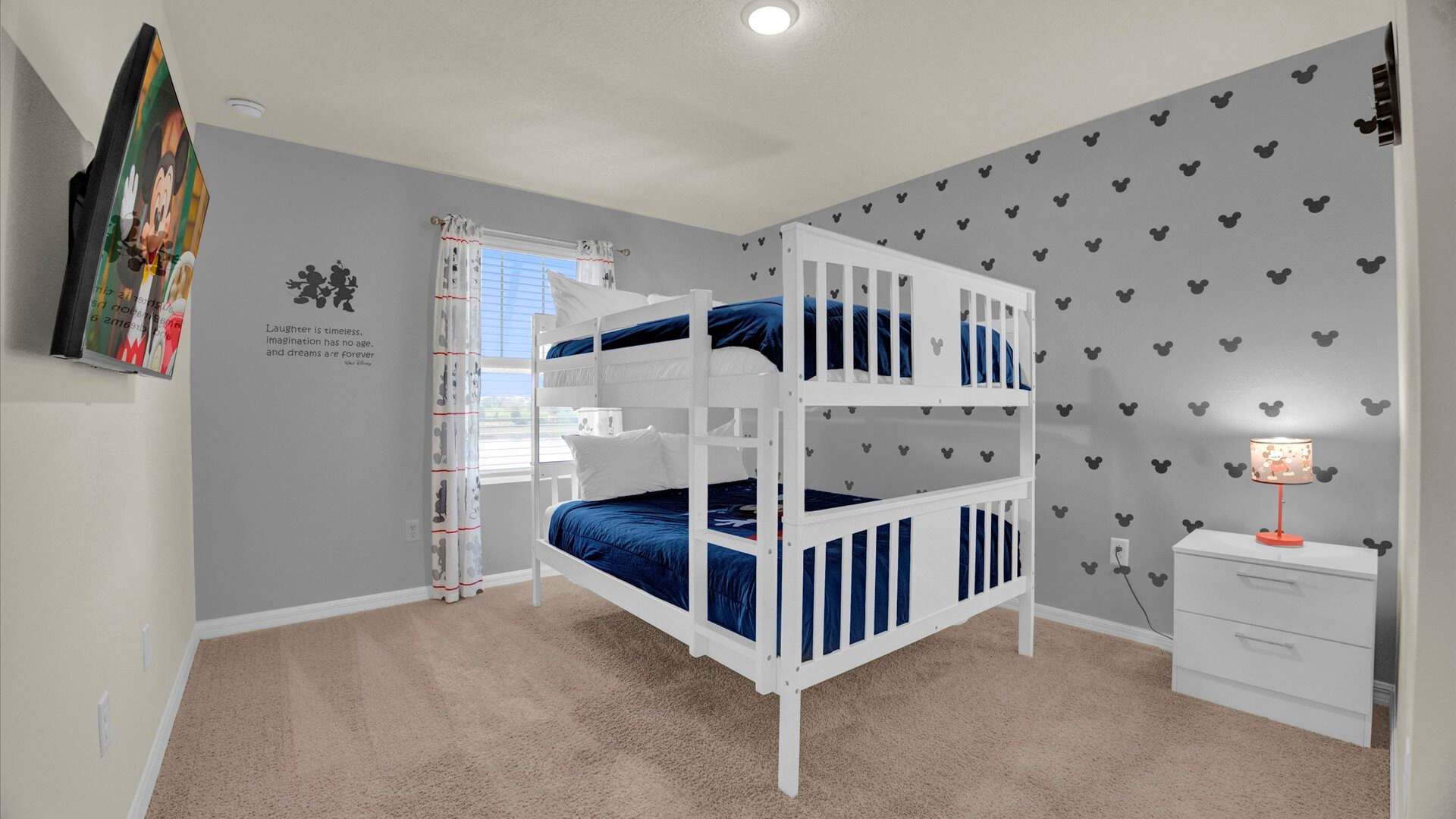 Mickey-Moused themed bunk bedroom with smart TV