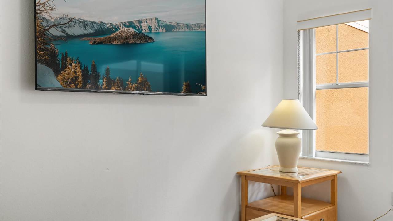 Living room with smart TV and natural light