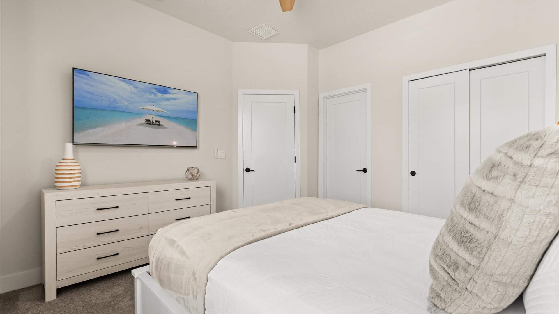 Queen bedroom with smart TV