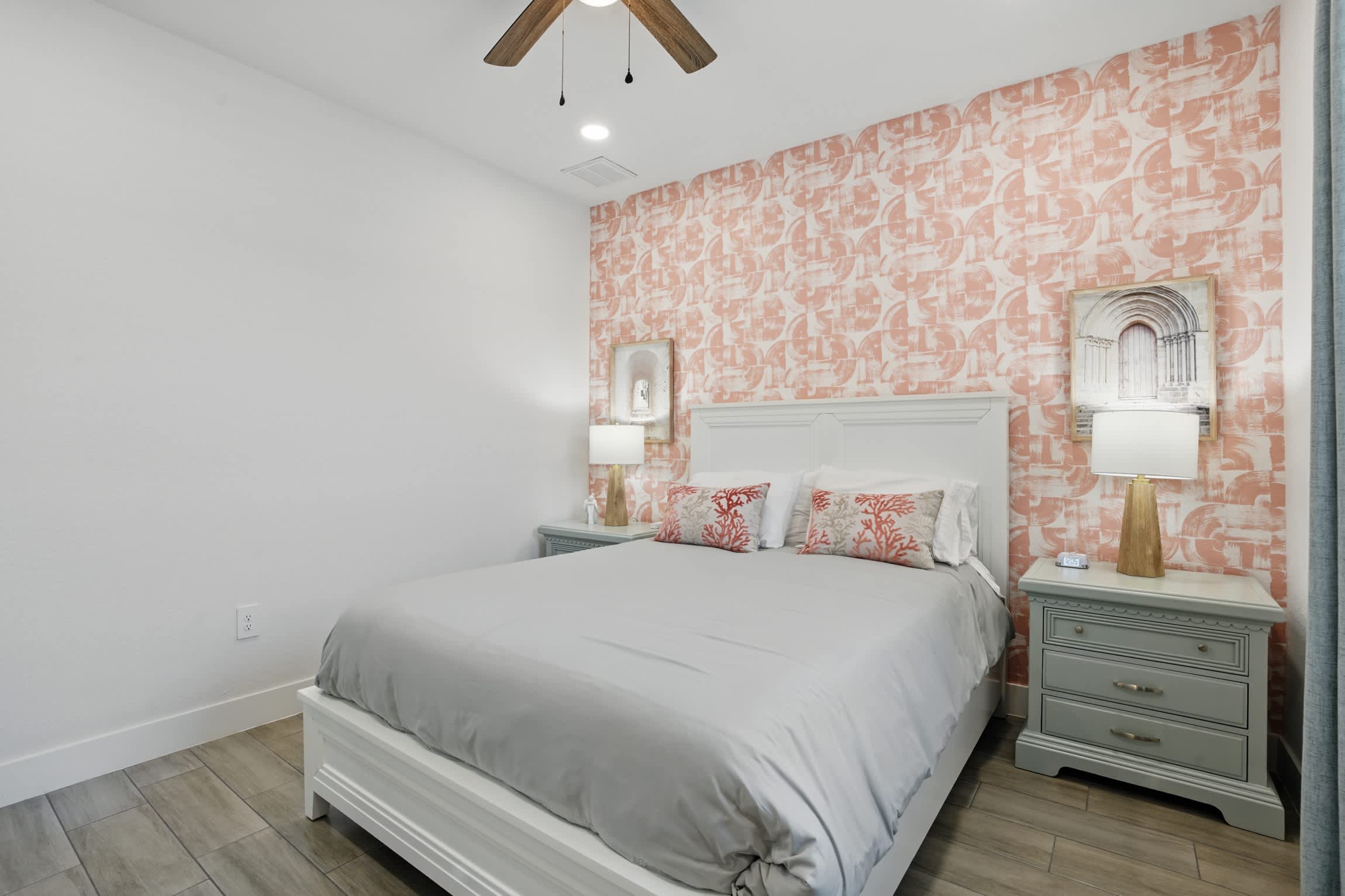 The second bedroom has 2 nightstands and lamps 