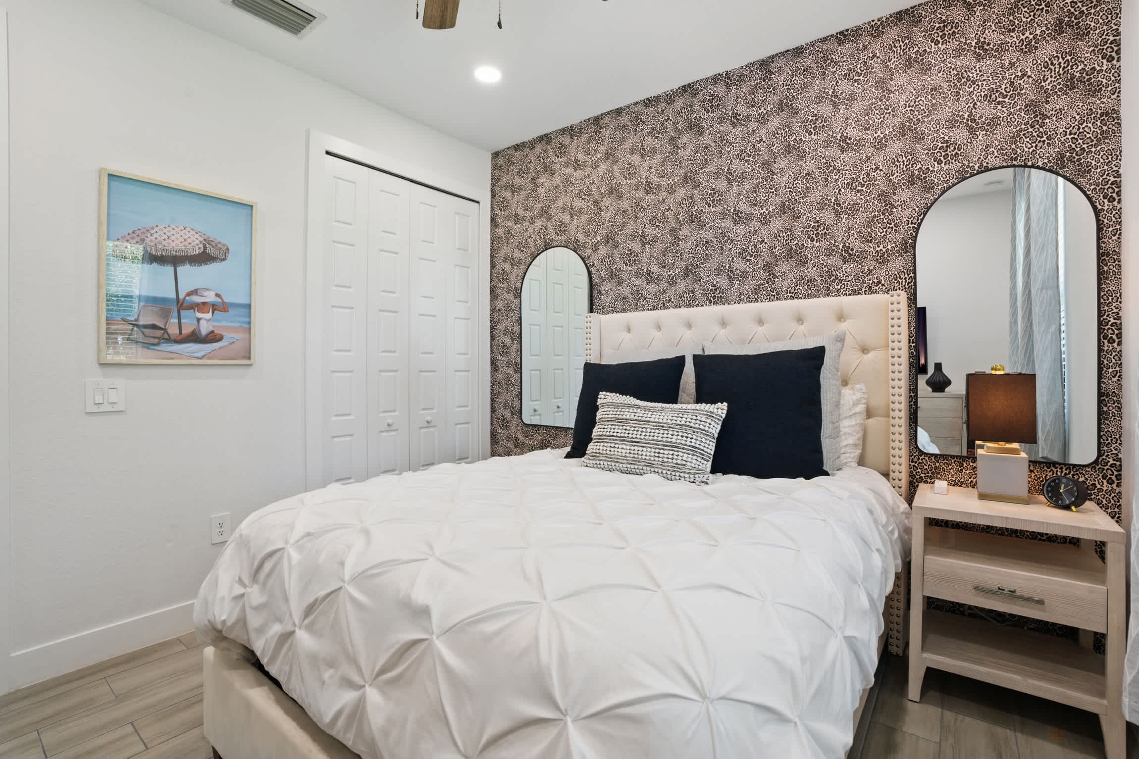 Bedroom #3 has dual mirrors and a ceiling fan