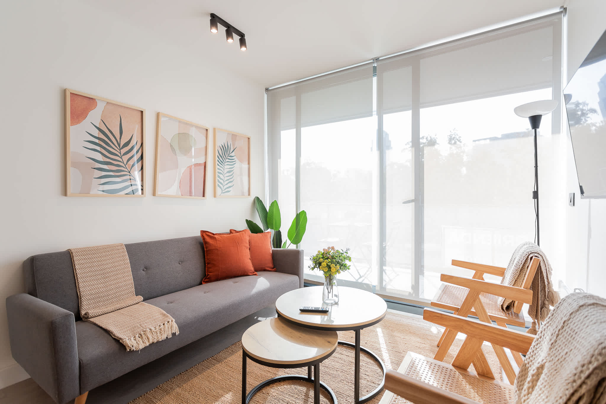 Experience comfort and style in this cozy living room, featuring modern decor and abundant natural light. Perfect for relaxation after a day of adventure!